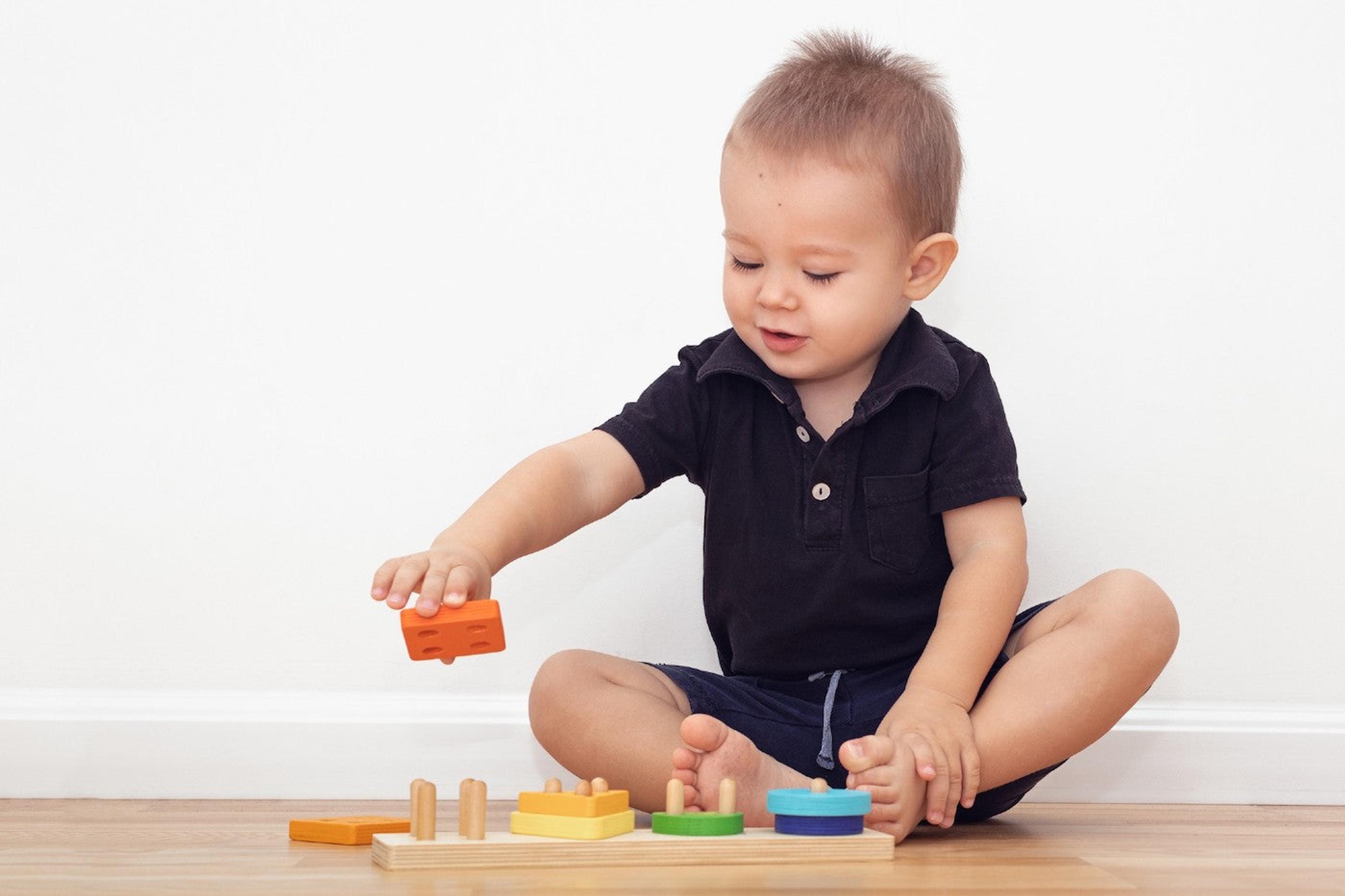 20-Month baby stacks blocks