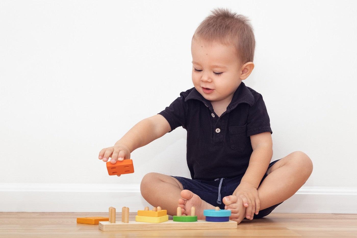 20-Month baby stacks blocks