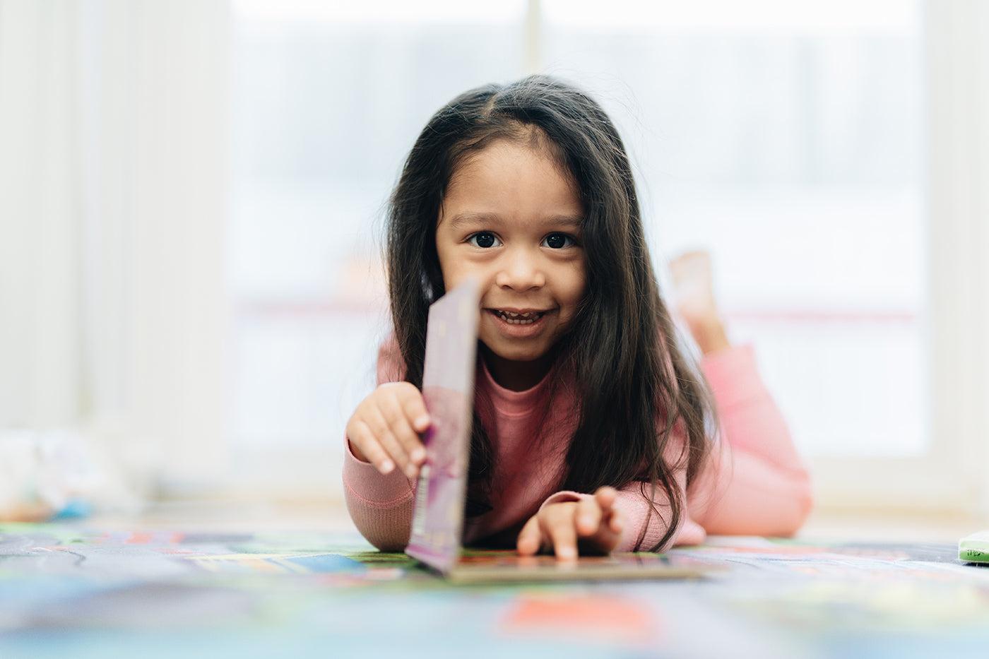 toddler reading book to get ready for first day of school