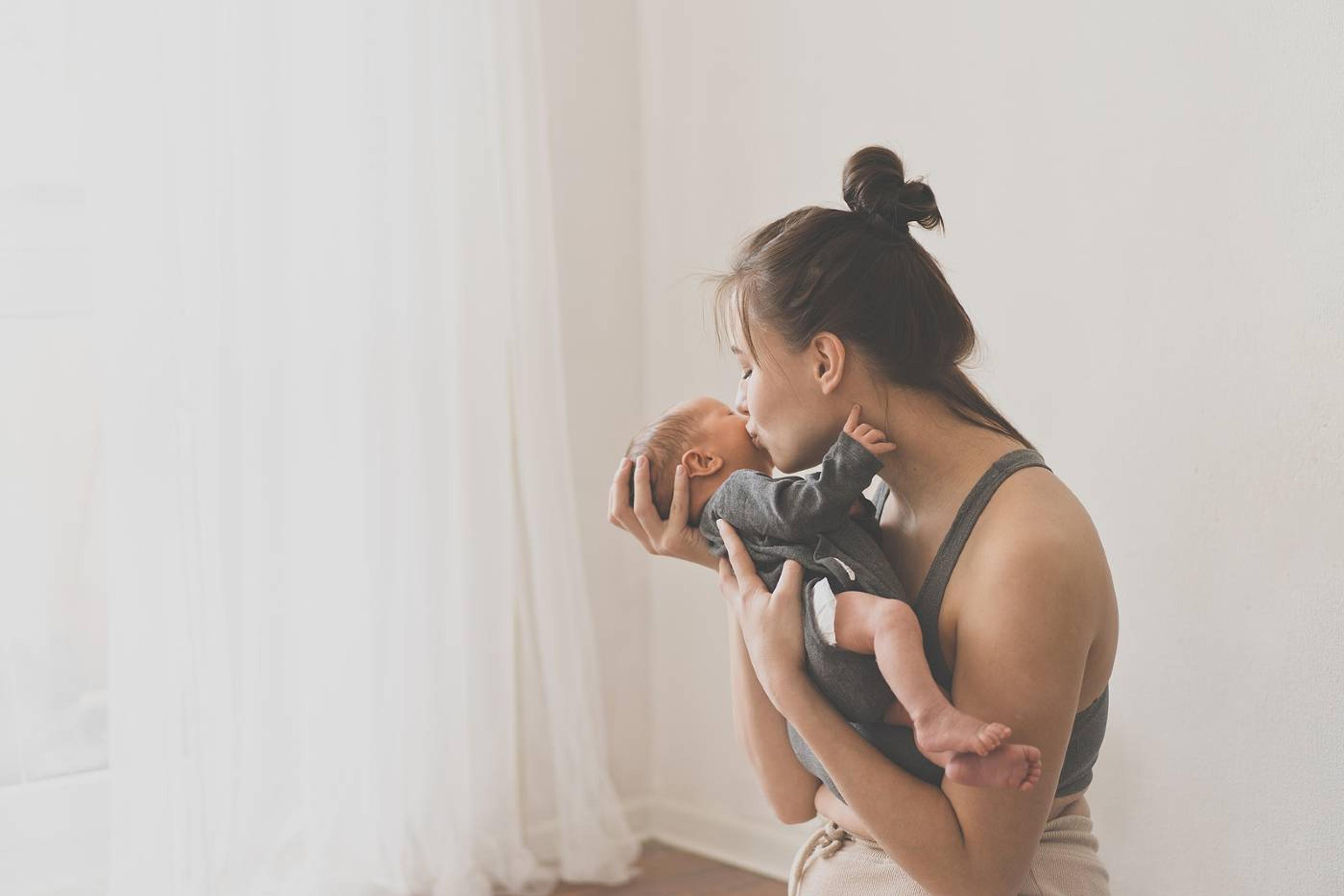 Mother holds newborn