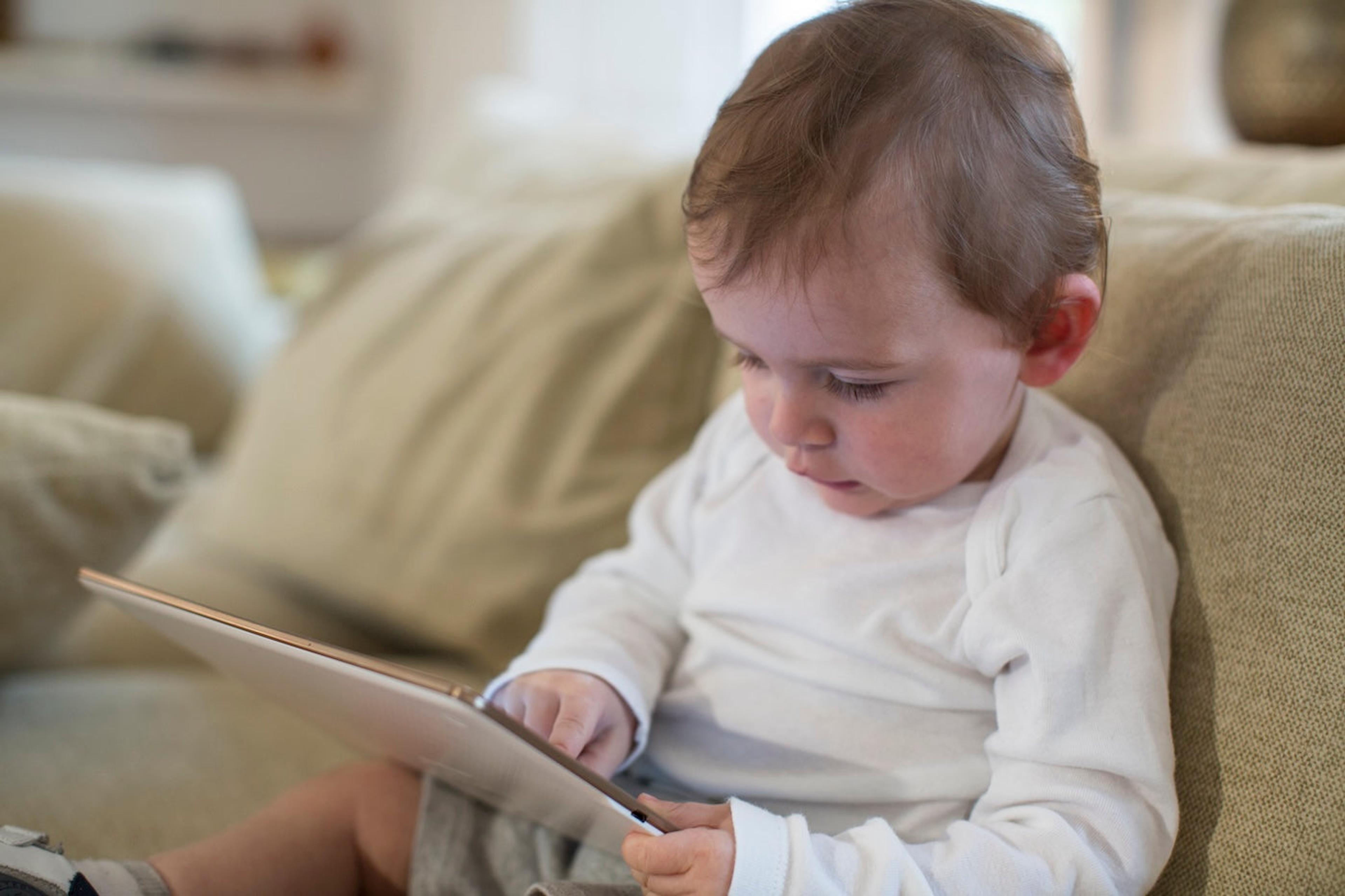 Toddler playing on a tablet