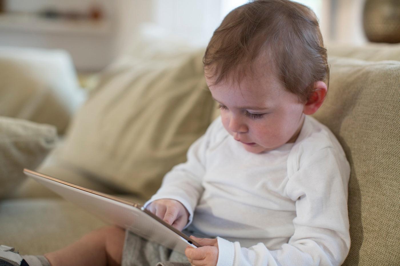 Toddler playing on a tablet