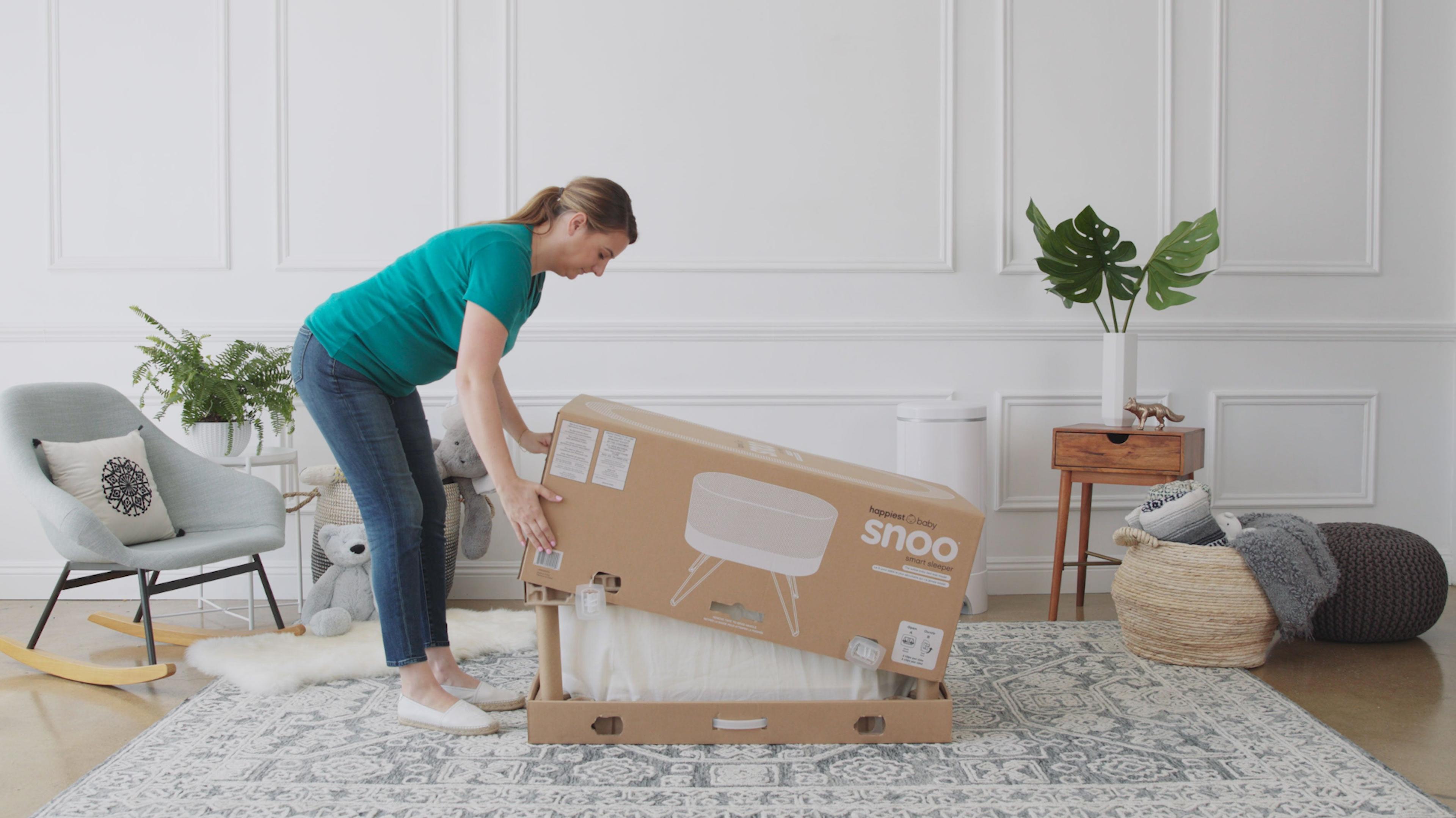 mom-repacking-snoo-smart-sleeper-in-box