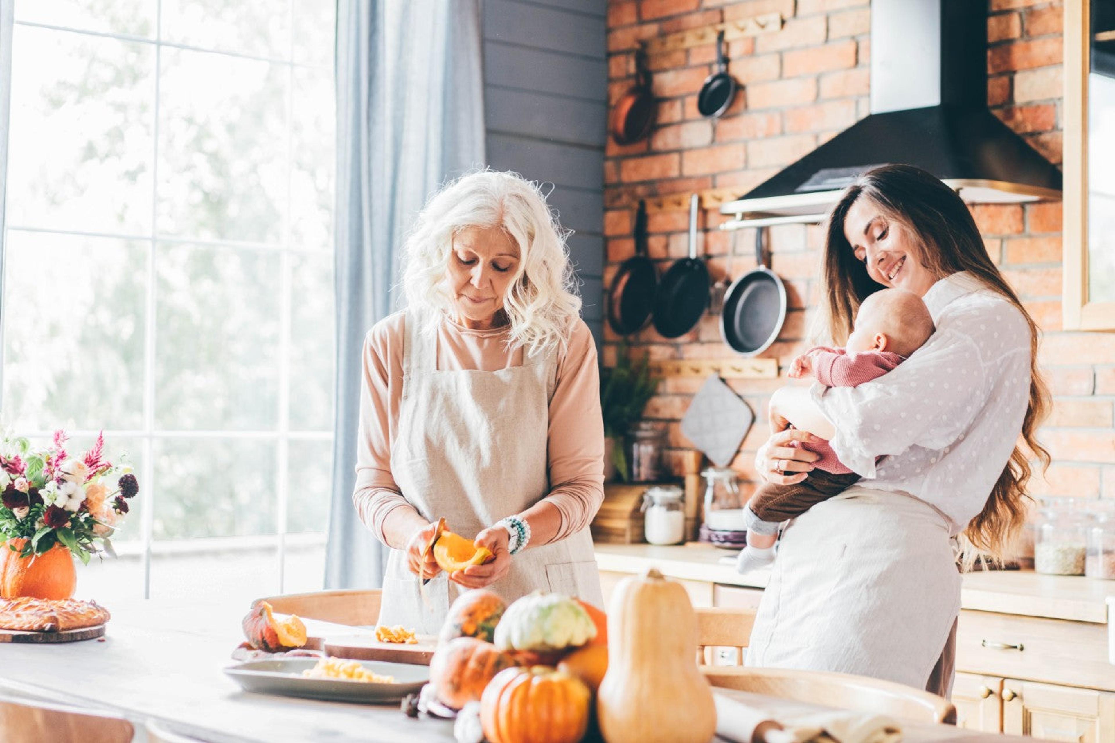 A mom and grandma celebrate a baby's first Thanksgiving