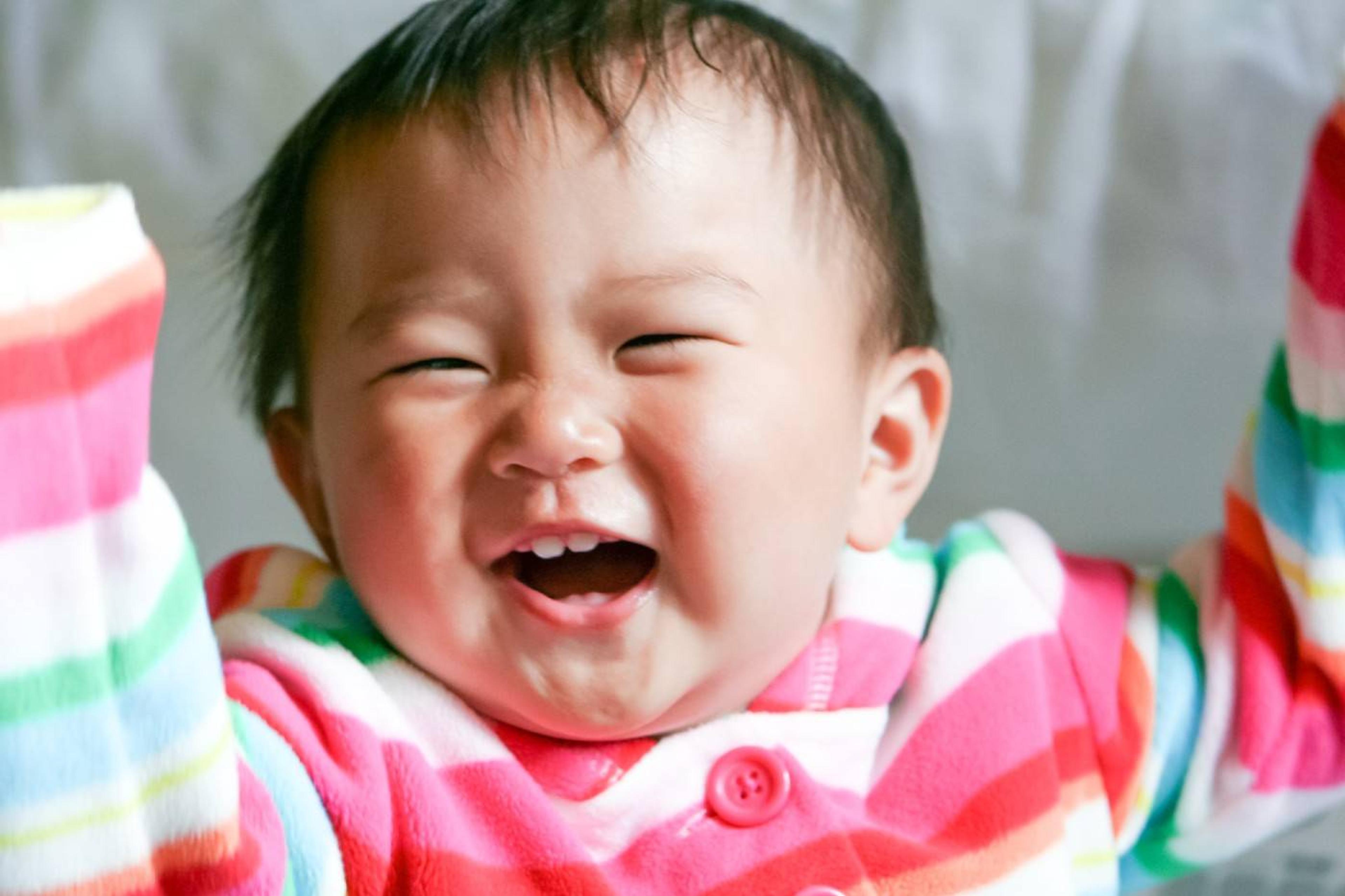 Baby showing first two teeth