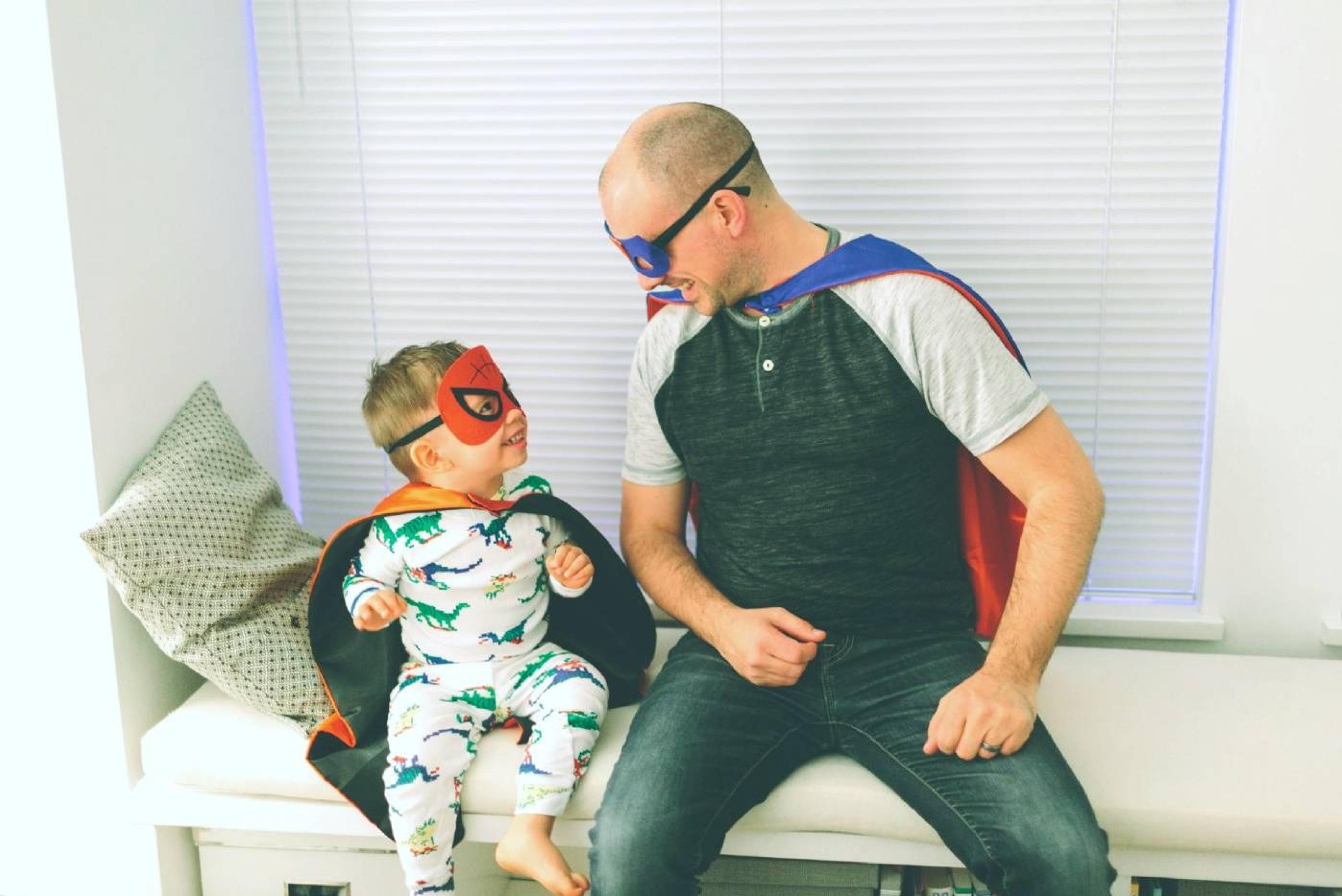 Toddler and dad dressed as superheros