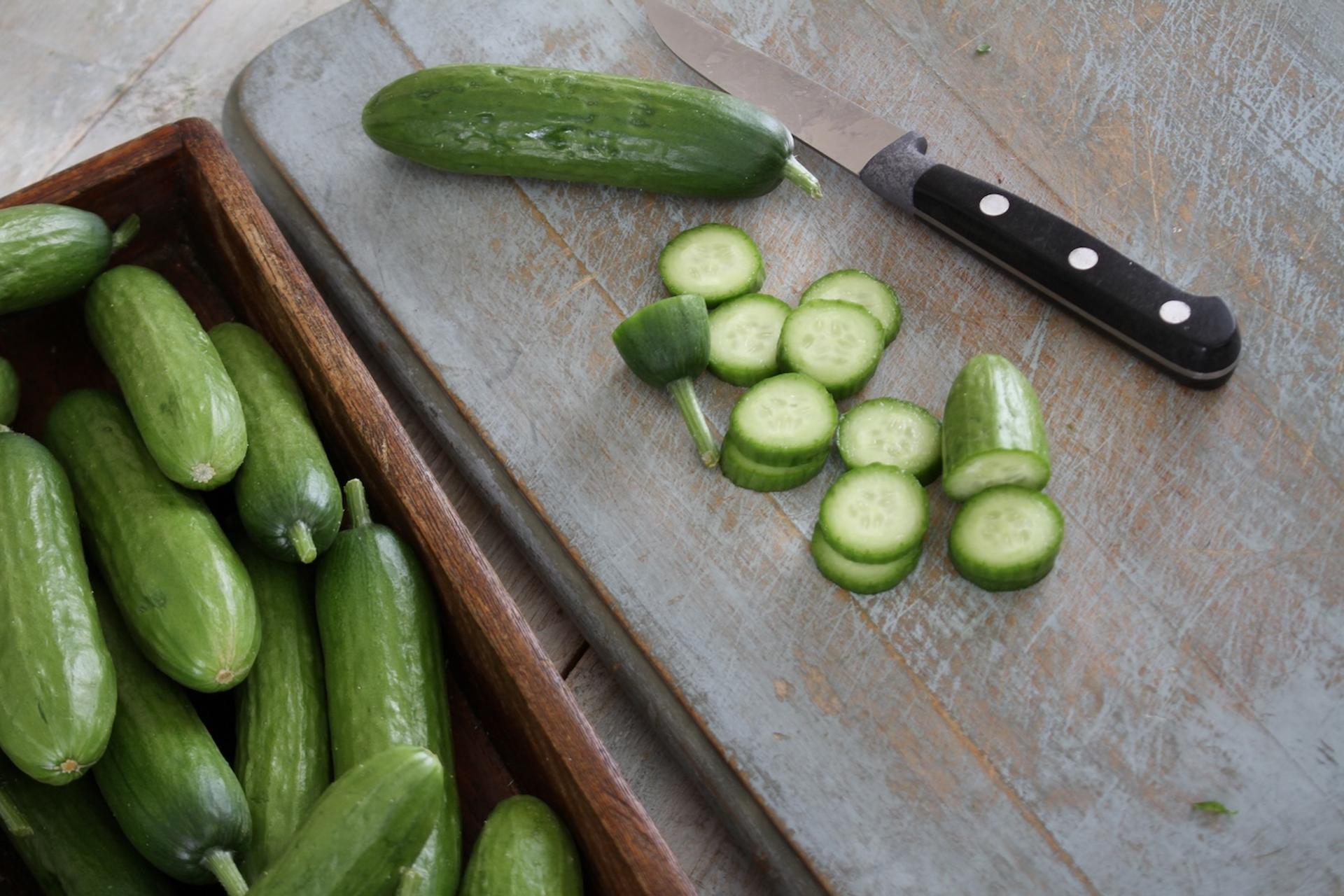 Chopped persian cucumber on a cutting board