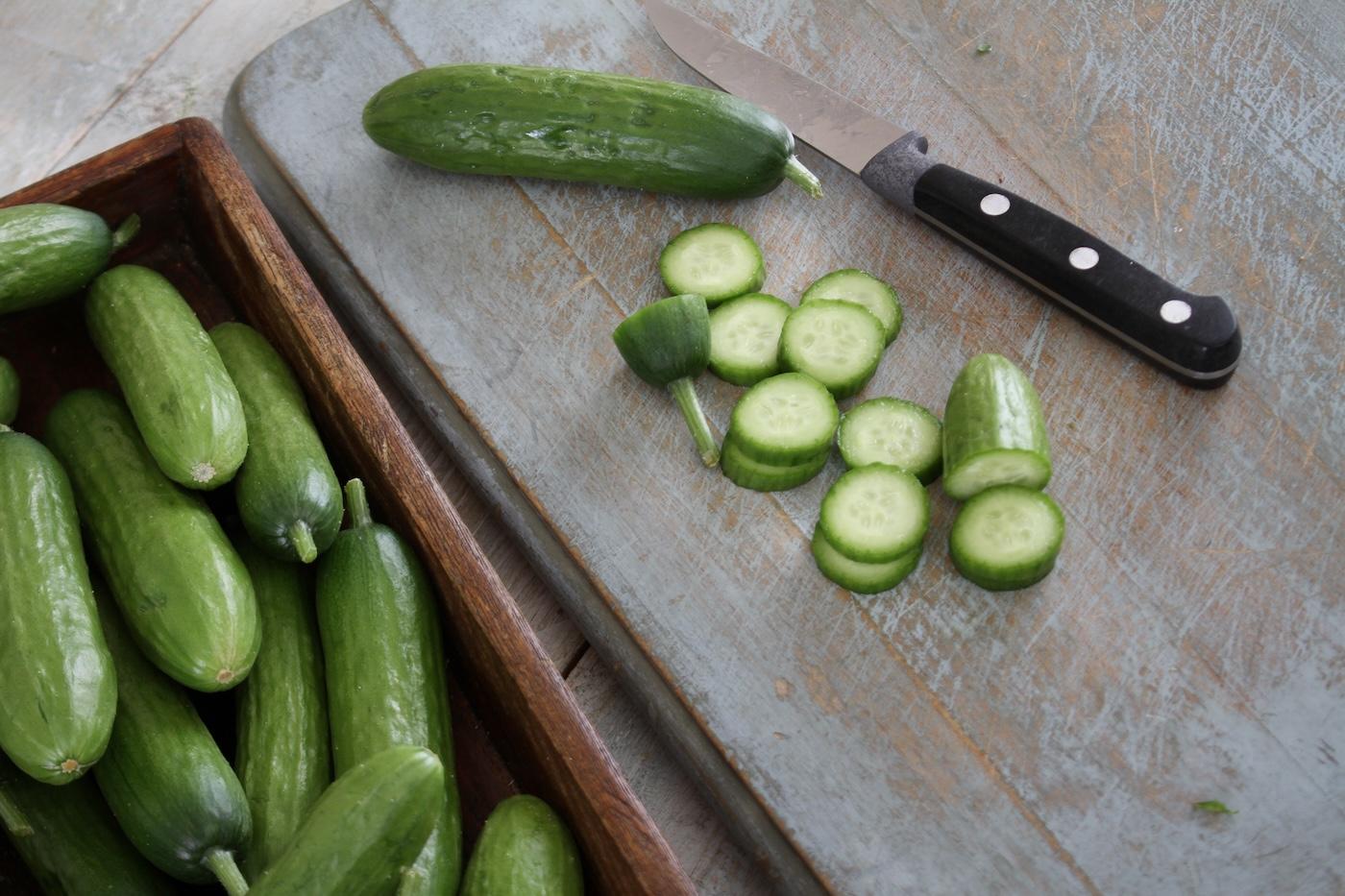 Chopped persian cucumber on a cutting board