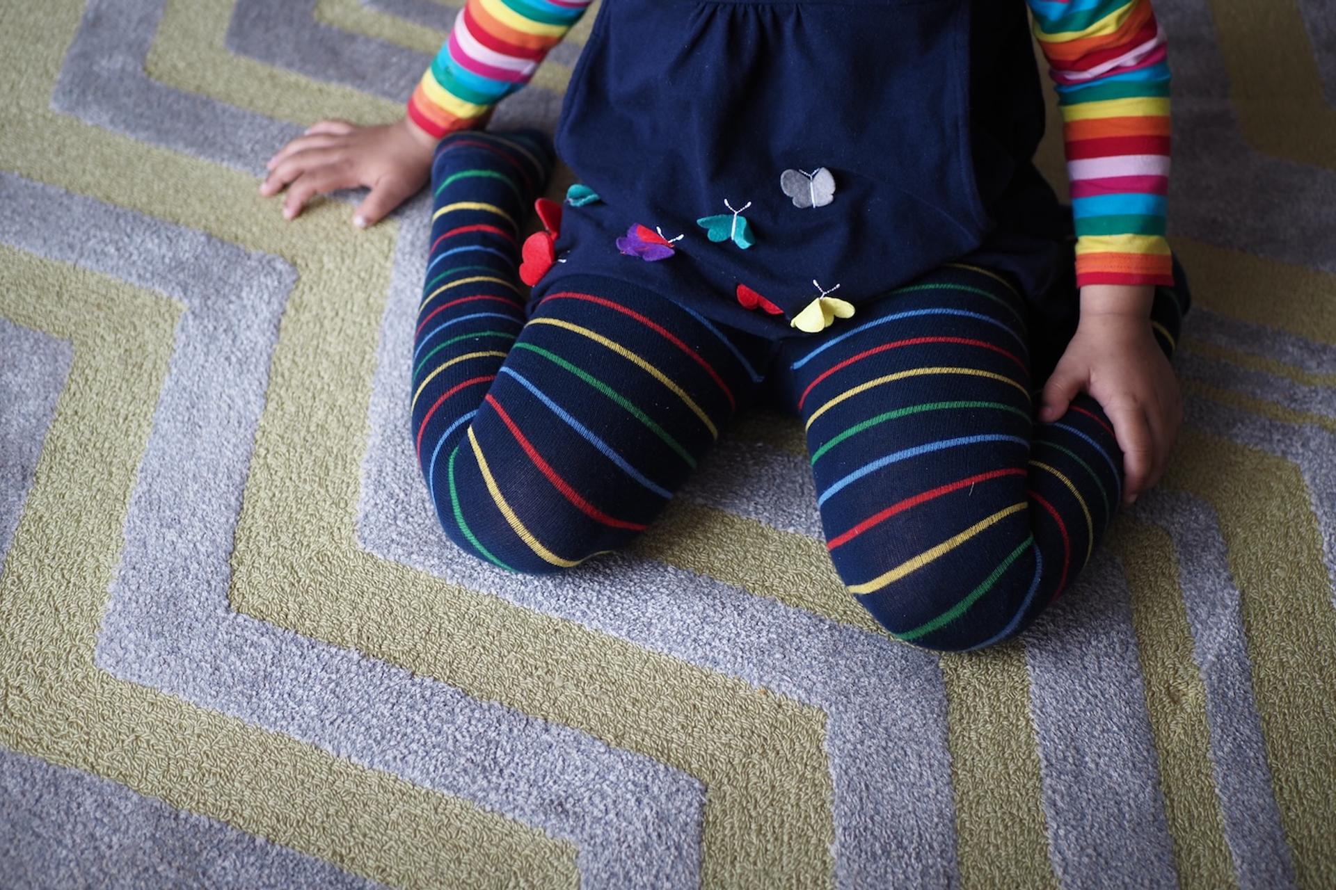 Toddler in a w-sitting position