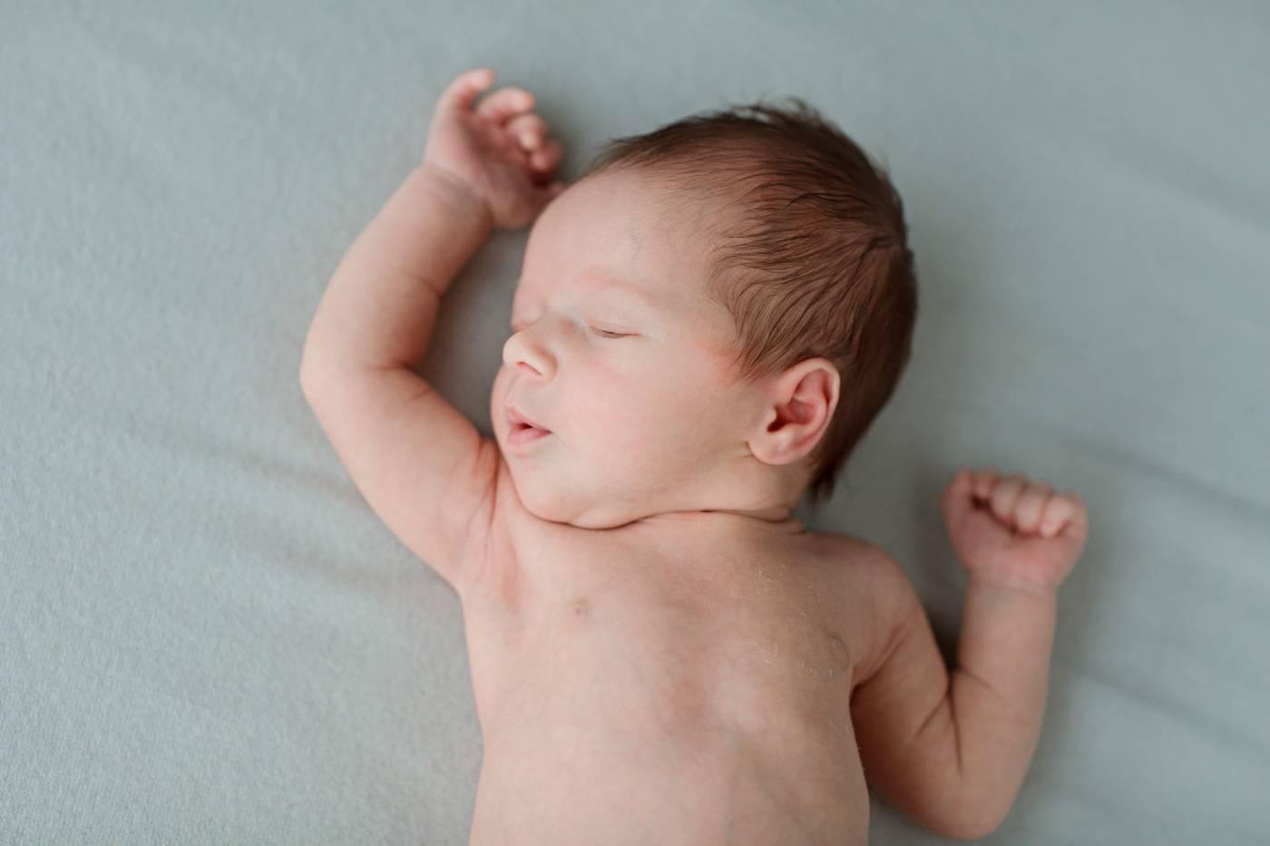 Infant sleeping safely on back