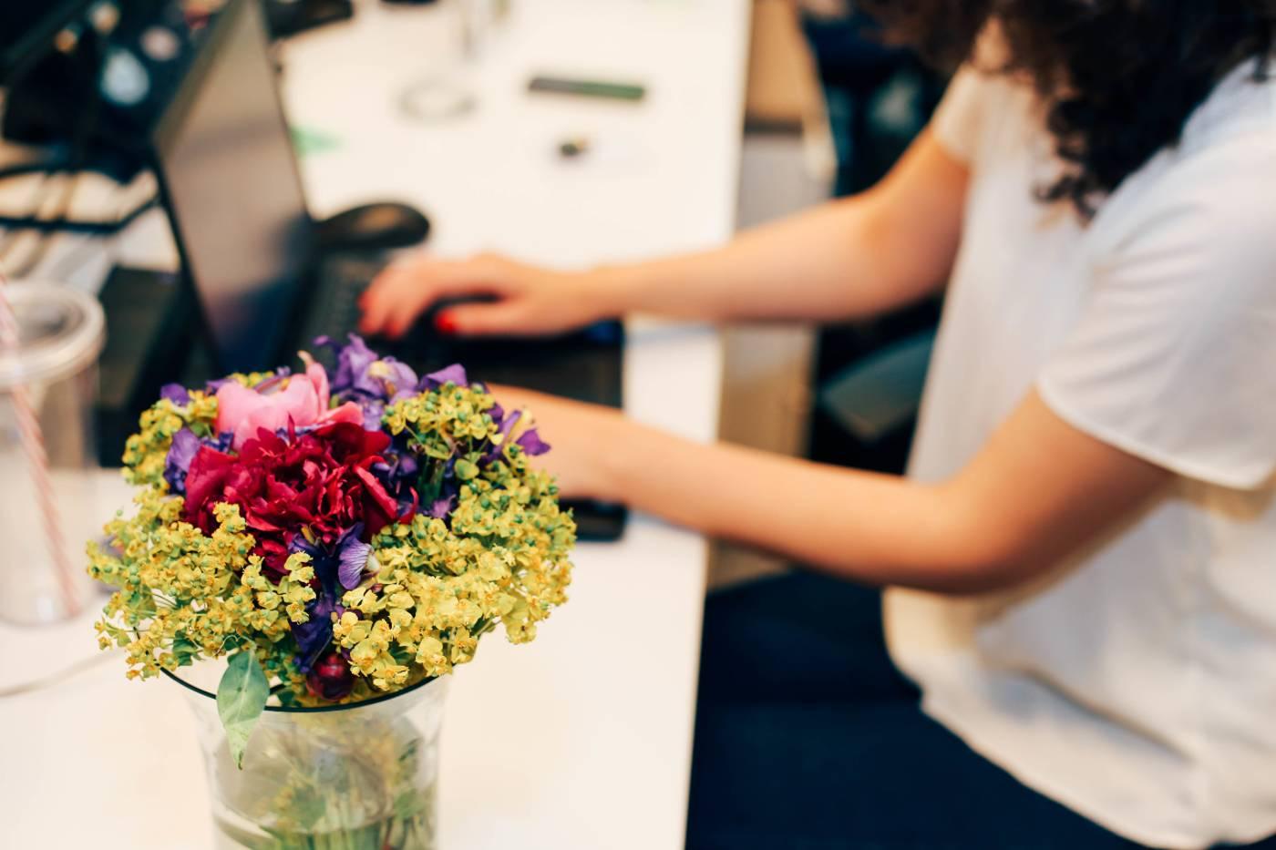 Welcome an Employee Back after Parental Leave: flowers on desk