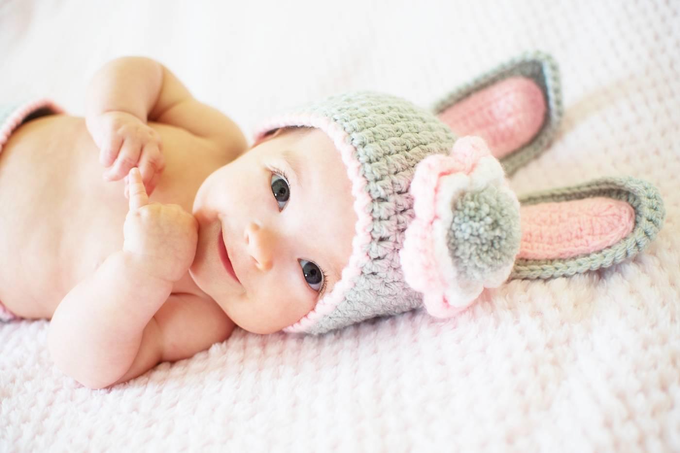 Baby in bunny ears who was born the year of the Rabbit!
