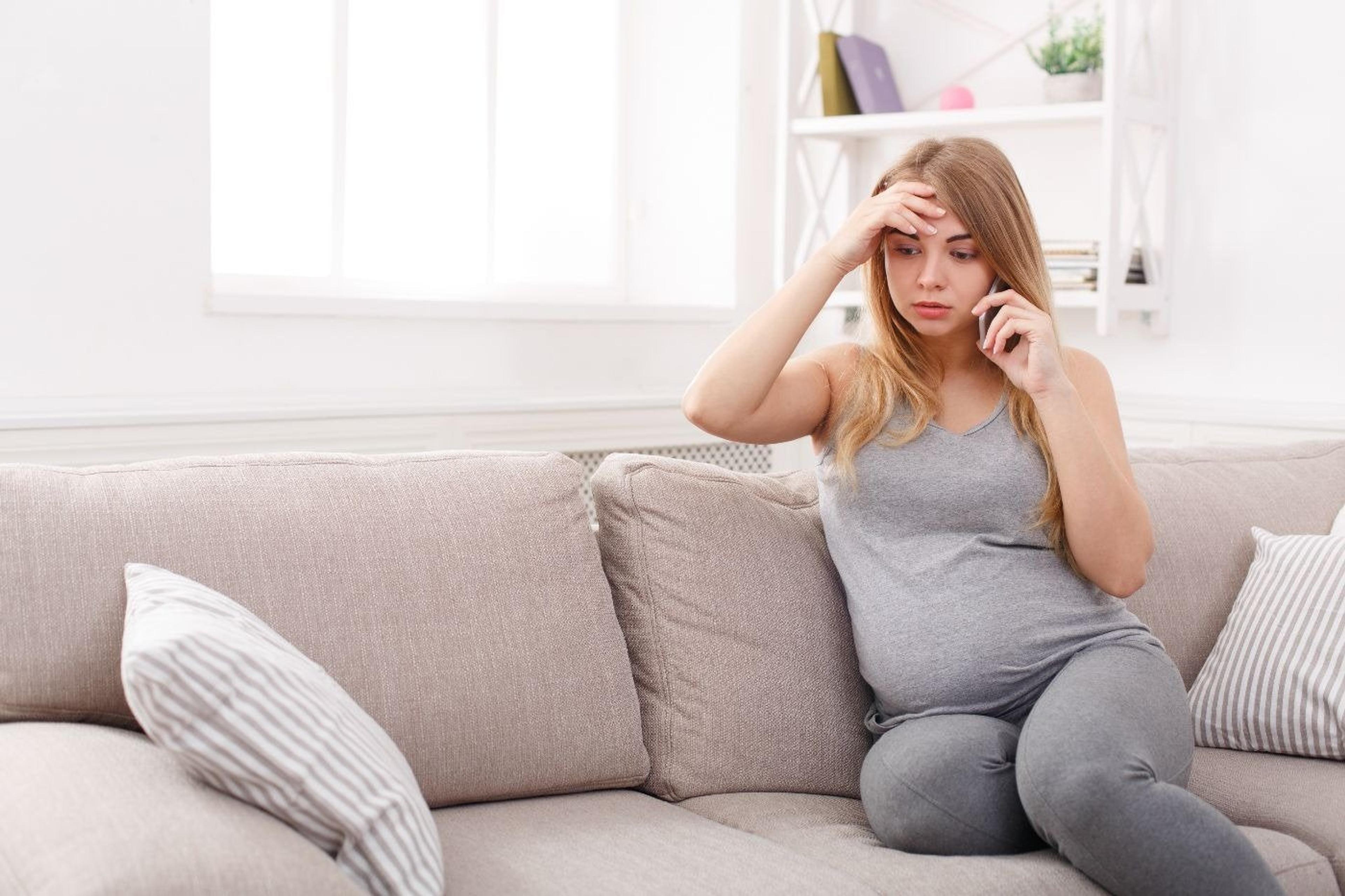 pregnant-mom-worried-on-the-phone