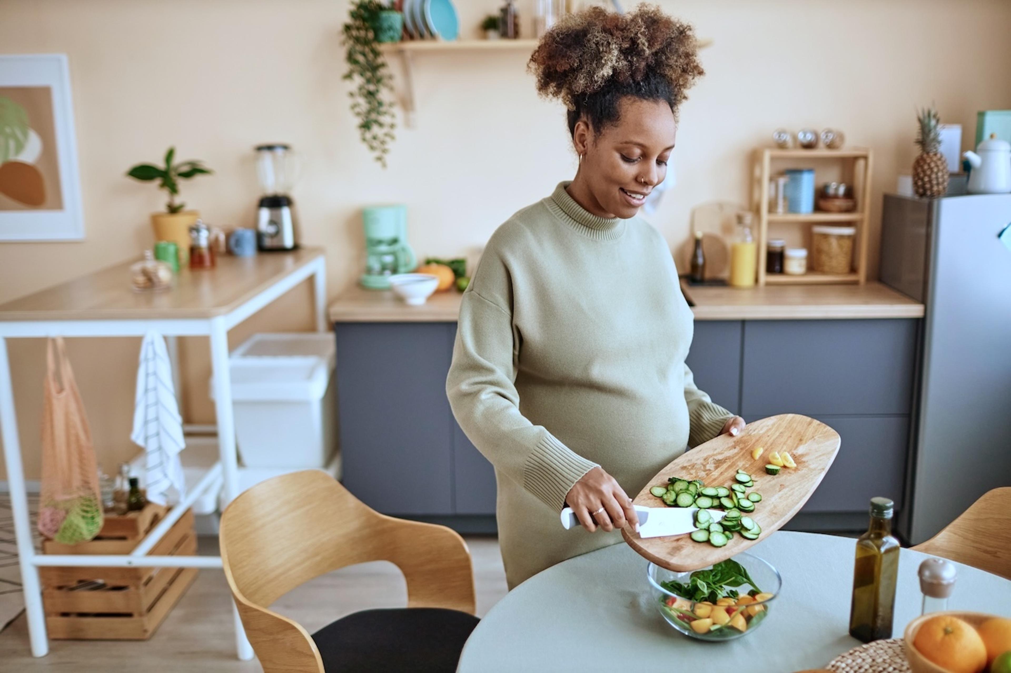 A pregnant woman prepares a gluten-free meal