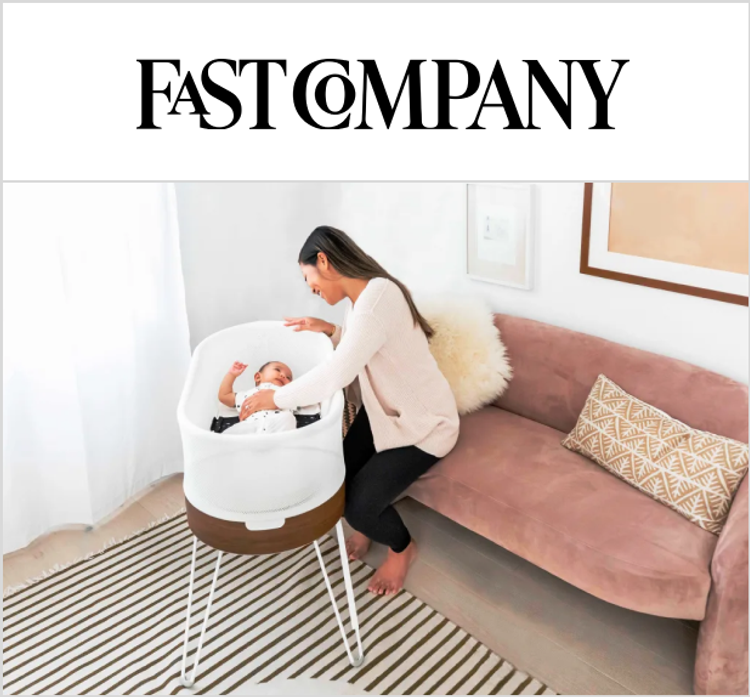 A magazine image featuring the SNOO bassinet with a woman and her baby inside