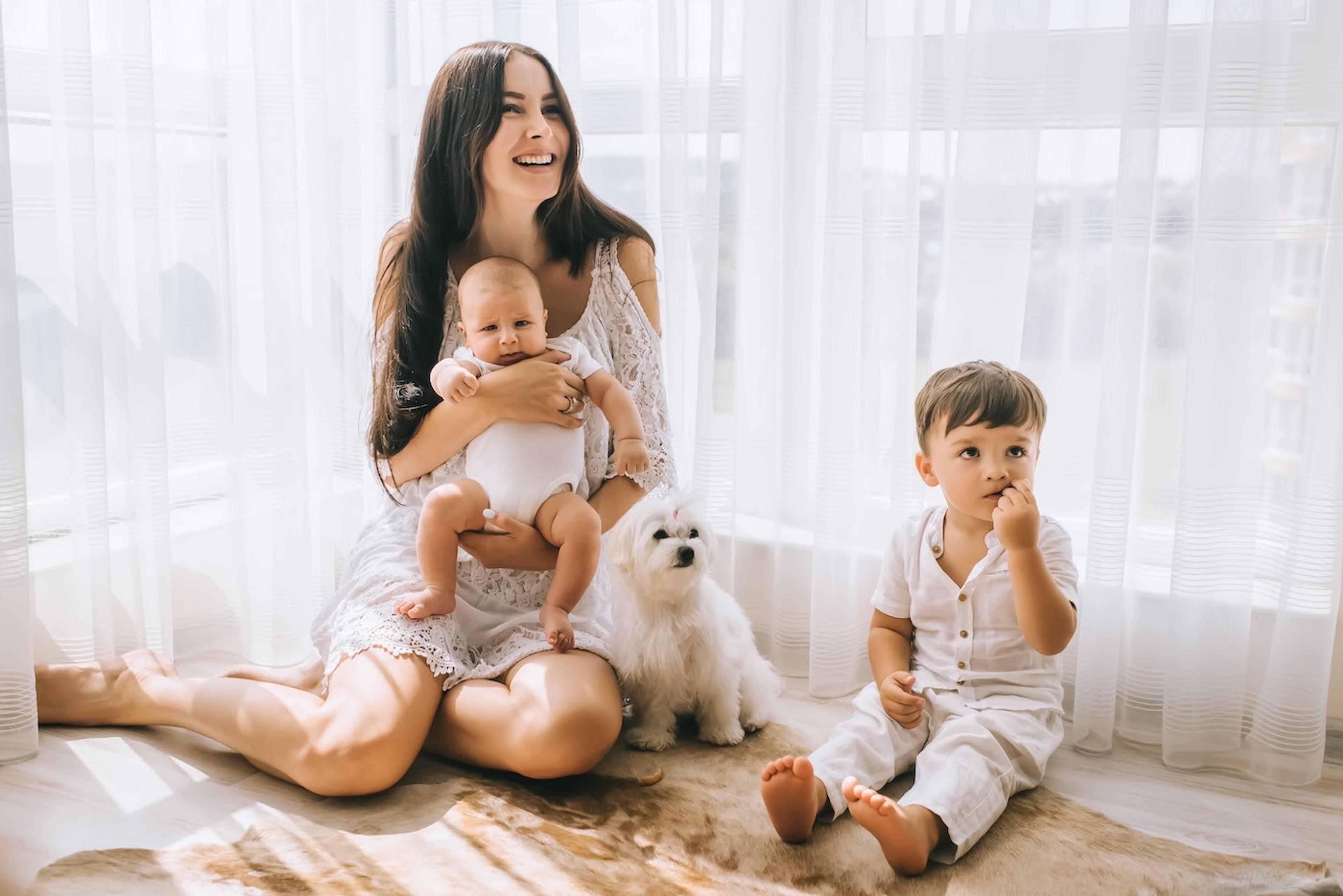 A mom with a newborn and young toddler