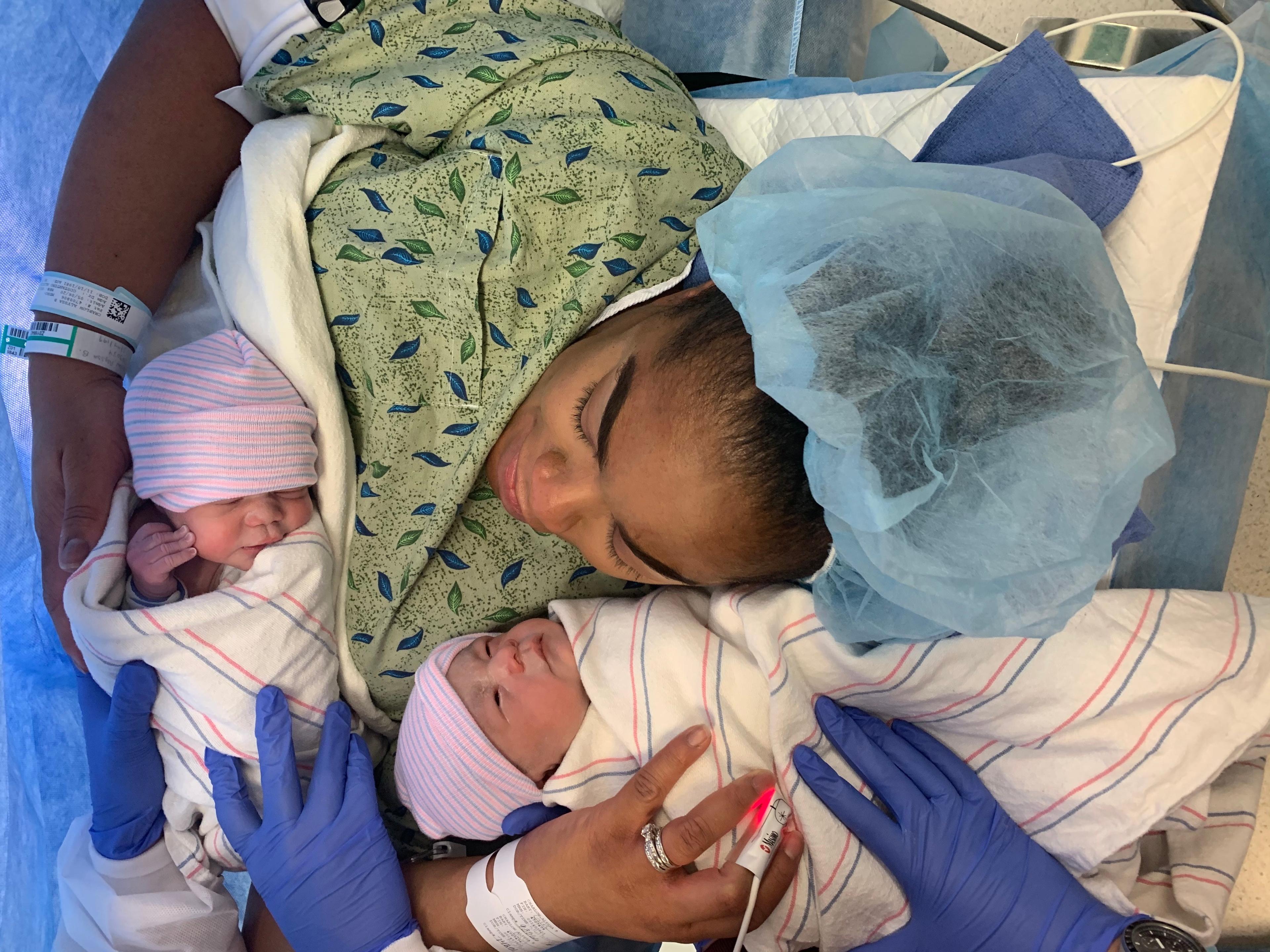 New mum Alyssa cradles her newborn twins immediately after giving birth