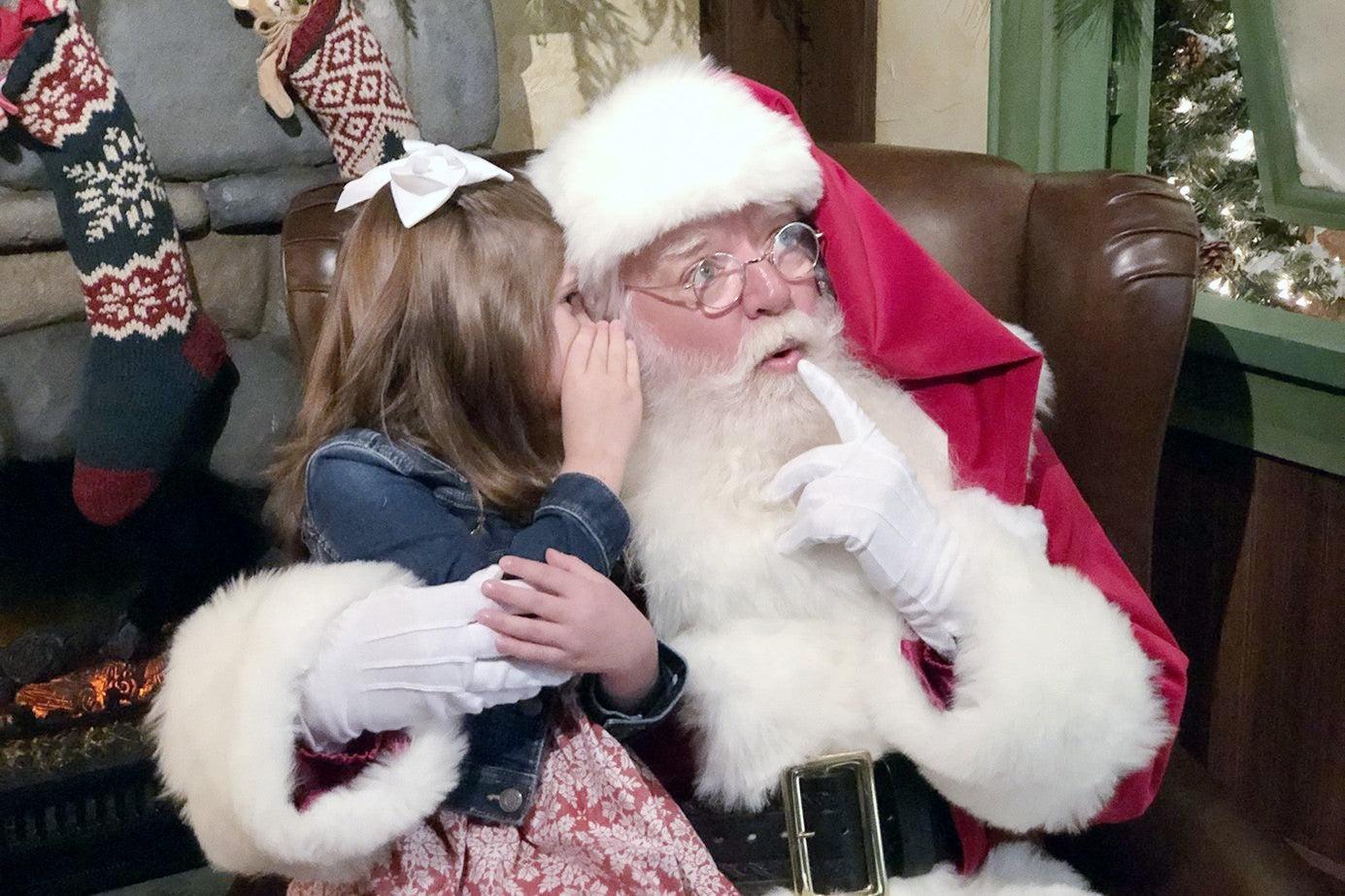 little-girl-sitting-on-santas-lap