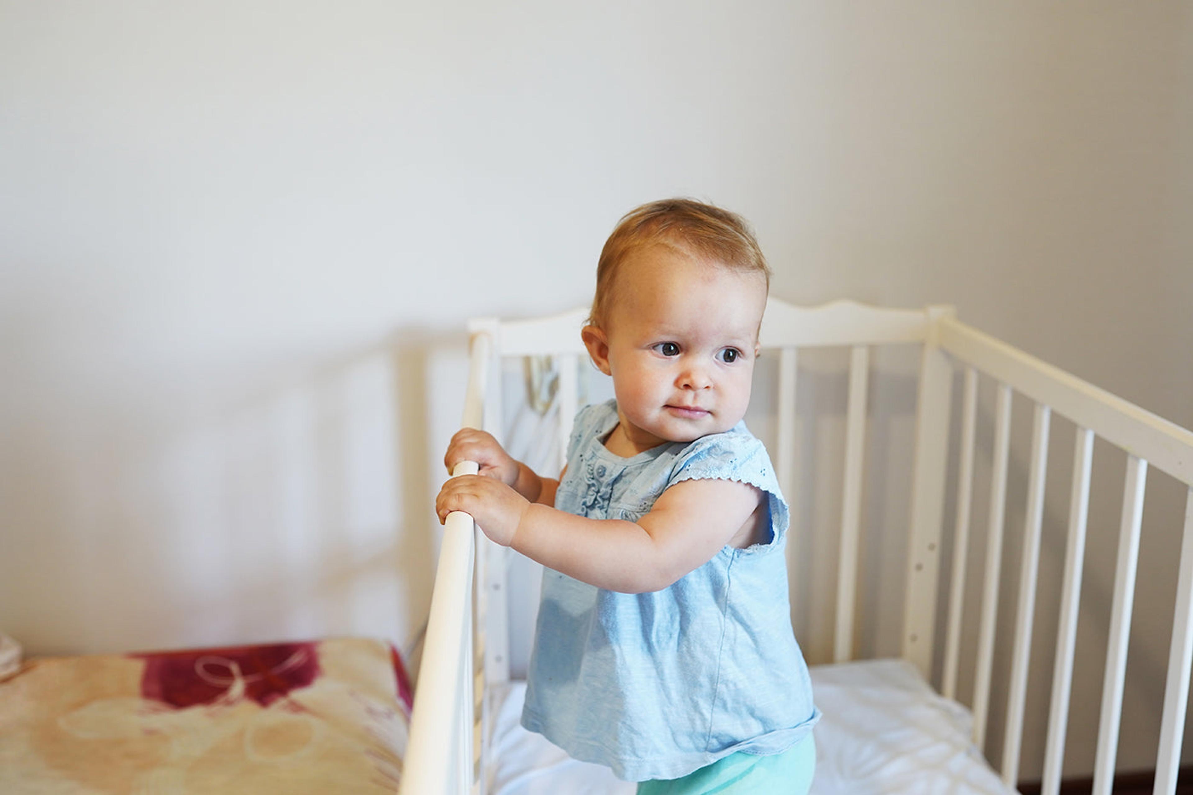 9 month sleep regression: baby pulling up to stand in crib