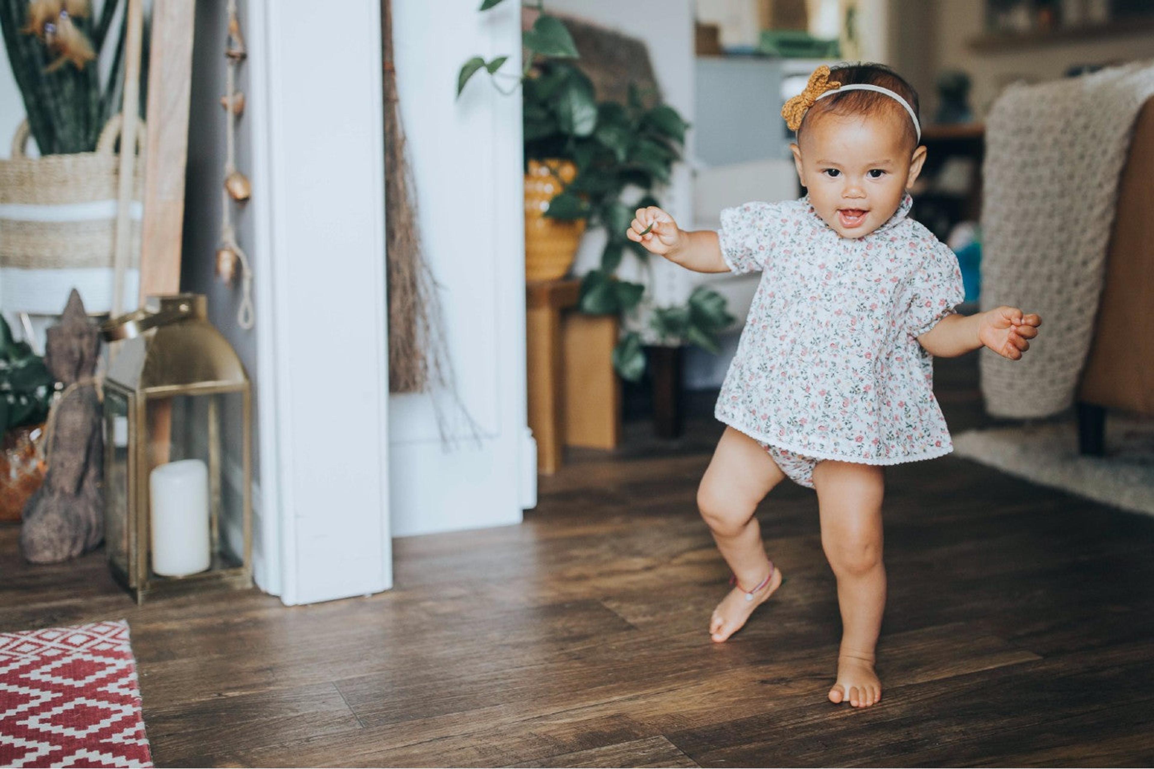 11-month-old baby girl taking first steps