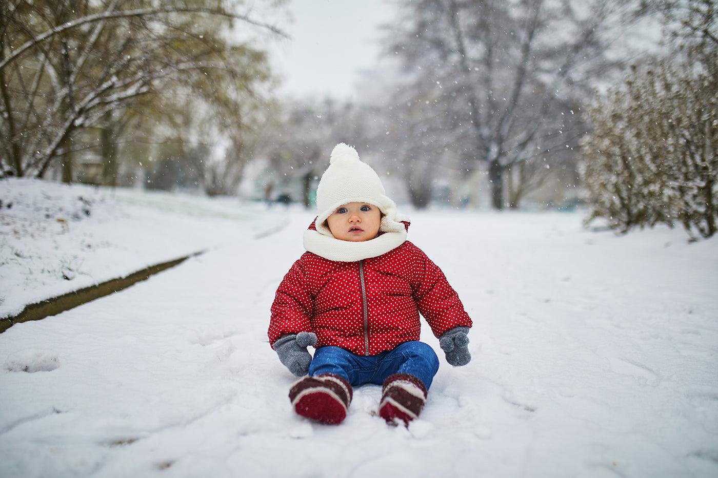 toddler-sitting-in-snow-february