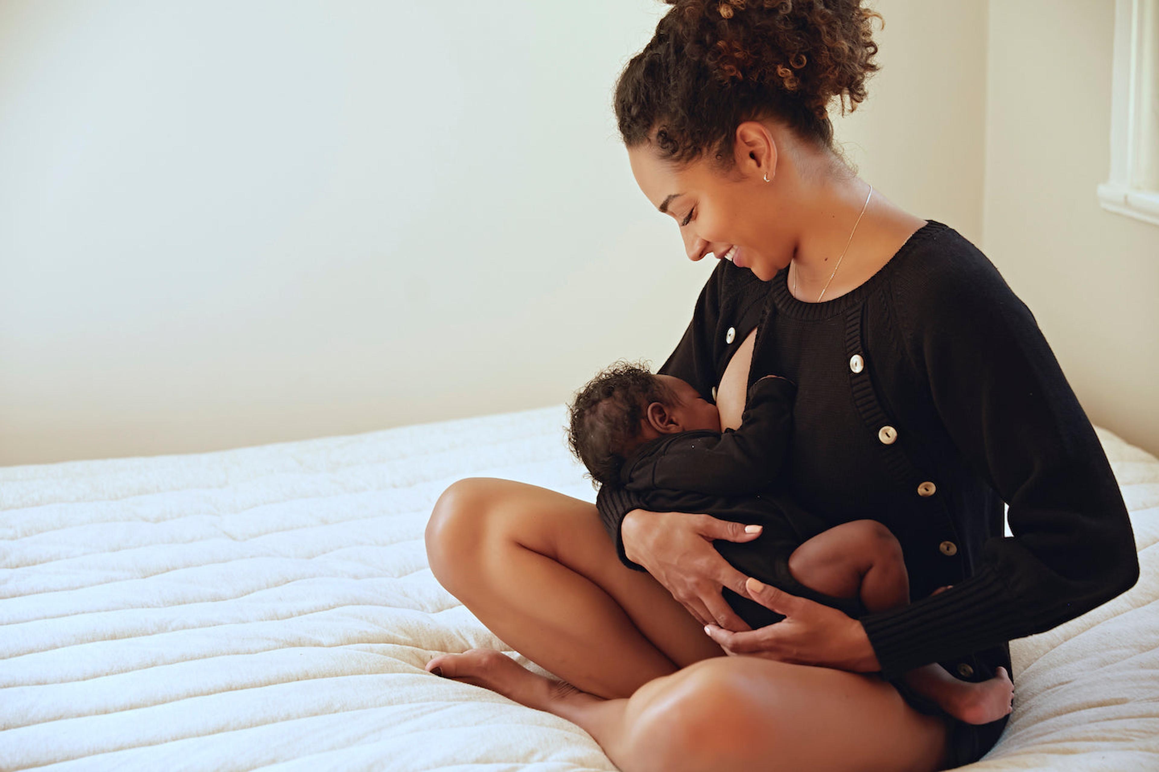 Rachel Nicks breastfeeds her son
