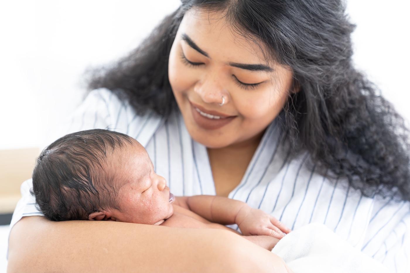 A new mother holds her newborn