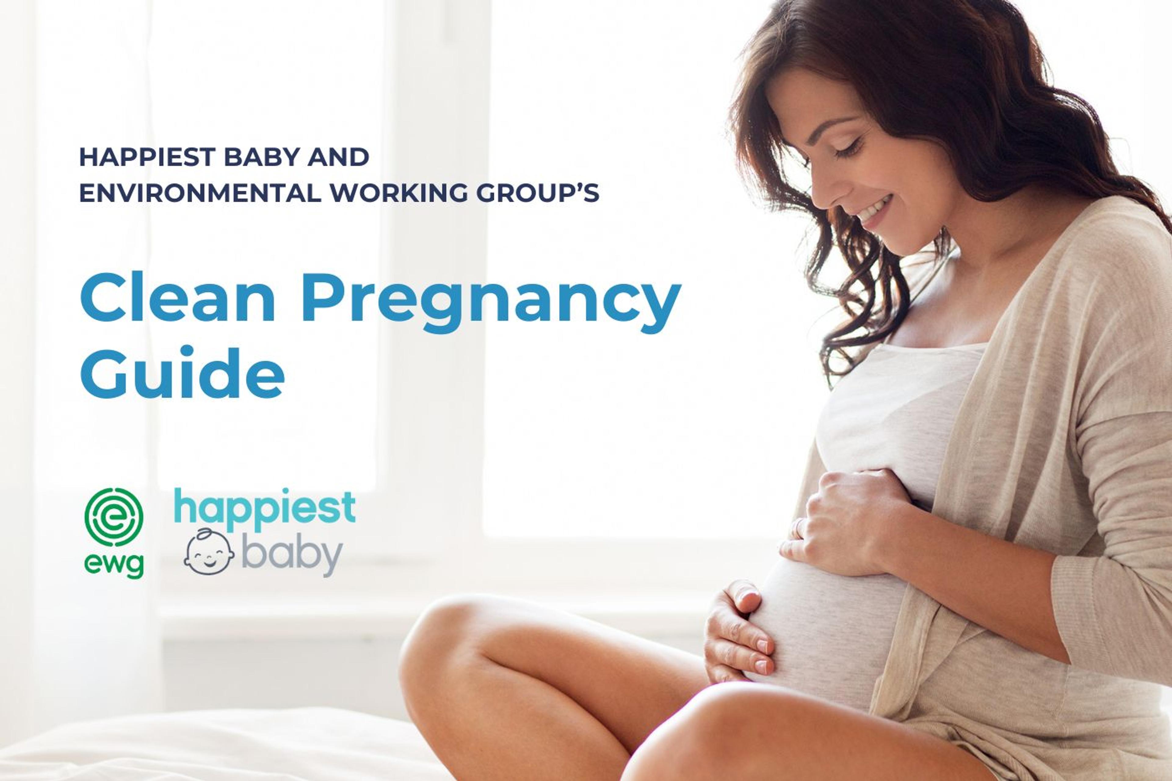 A pregnant woman looks at her belly