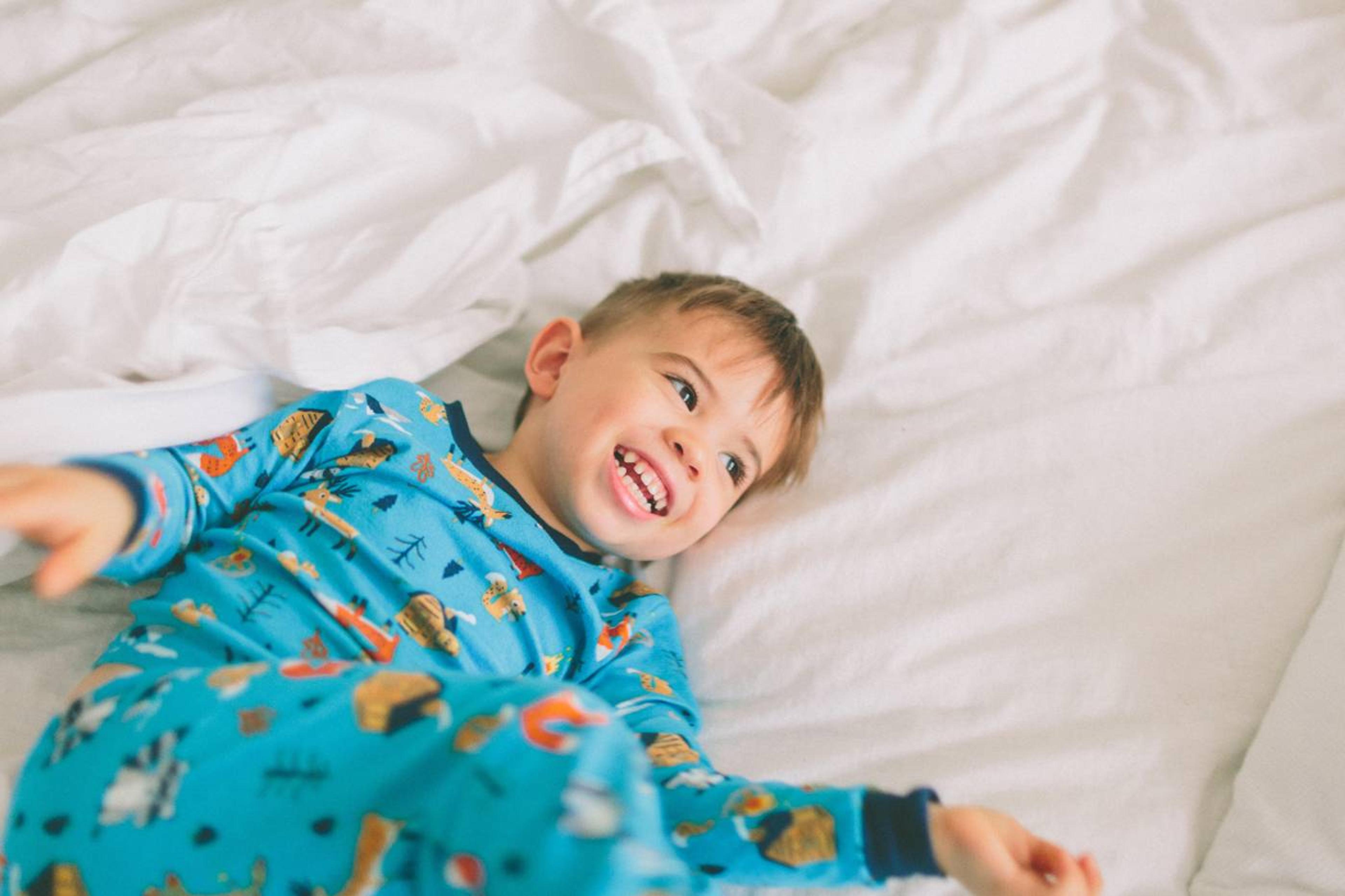 boy in bed, ready for night potty training