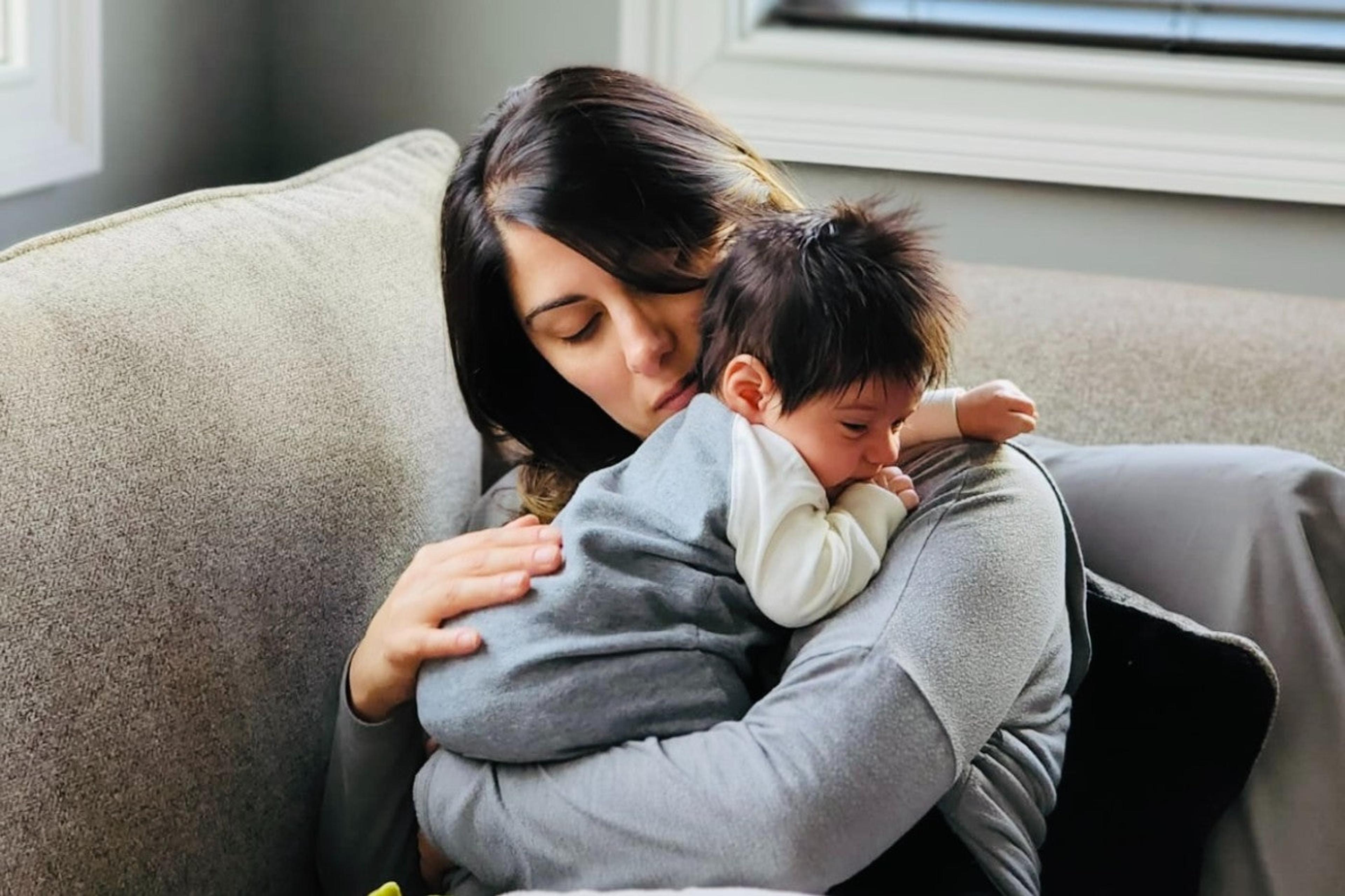Mom and psychologist Michelle Casarella holds her infant son