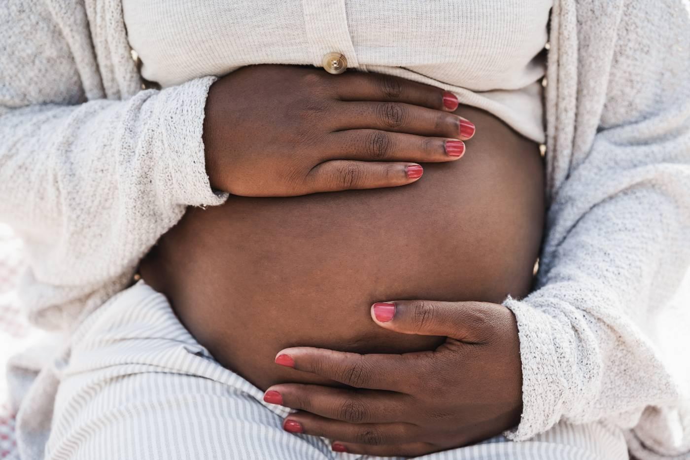 Black woman's pregnant belly