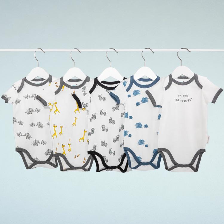 5 Baby Bodysuits hanging on a hanger