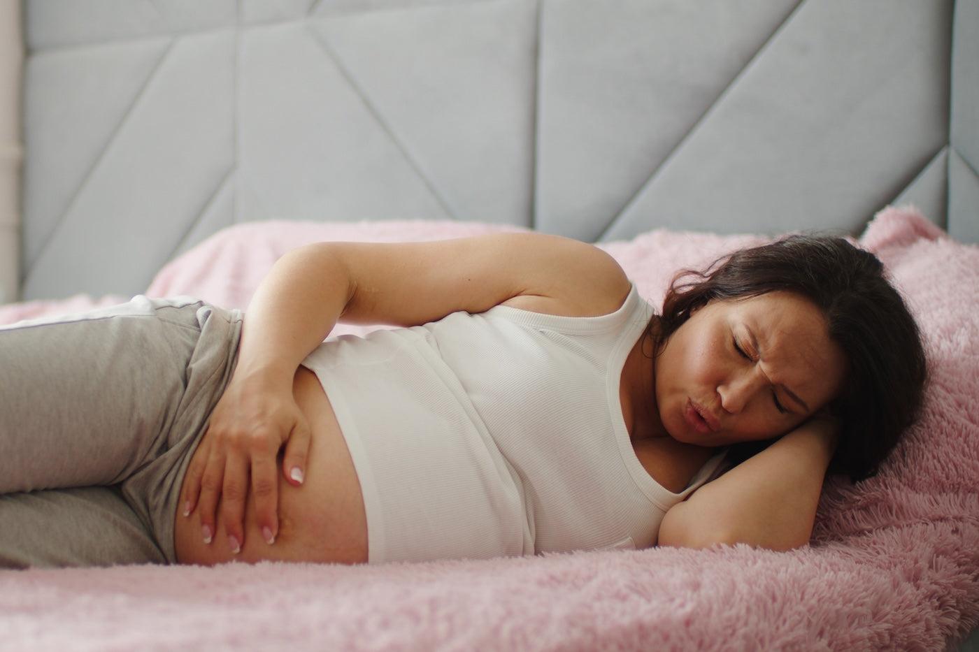 A pregnant woman experiences false labor pains in bed