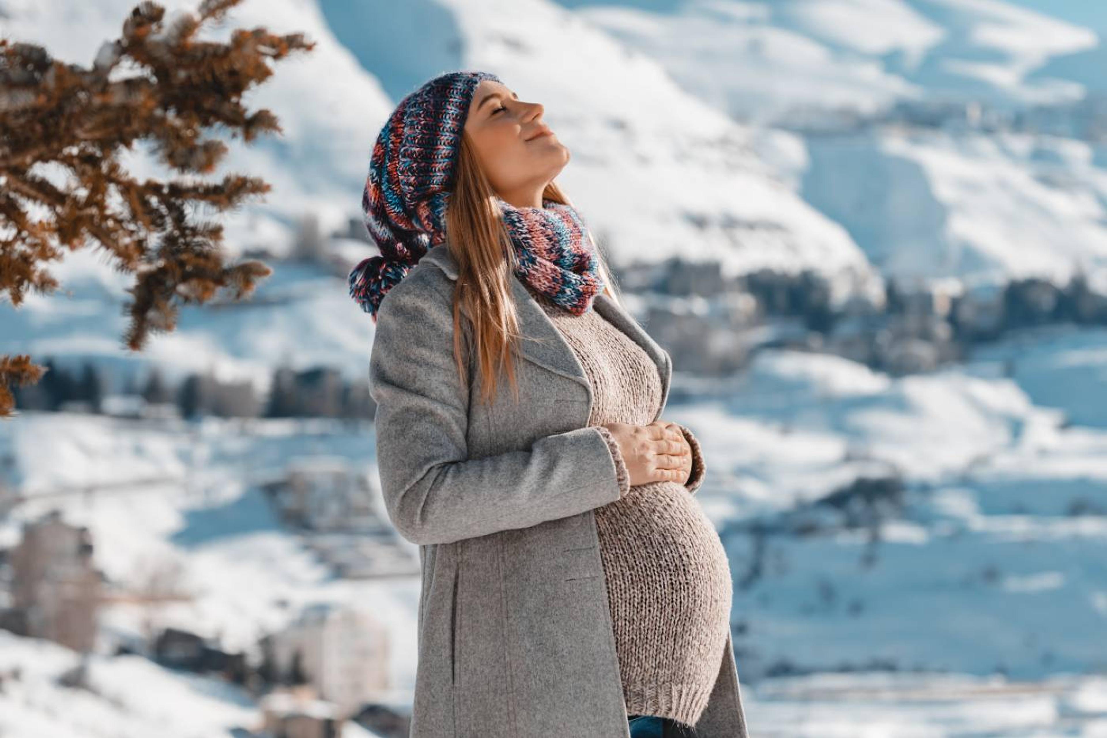 pregnant woman in snow: prepare for baby's winter arrival
