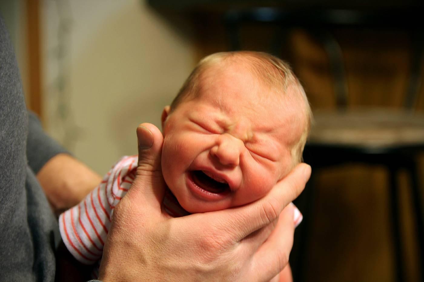 Gassy newborn getting burped