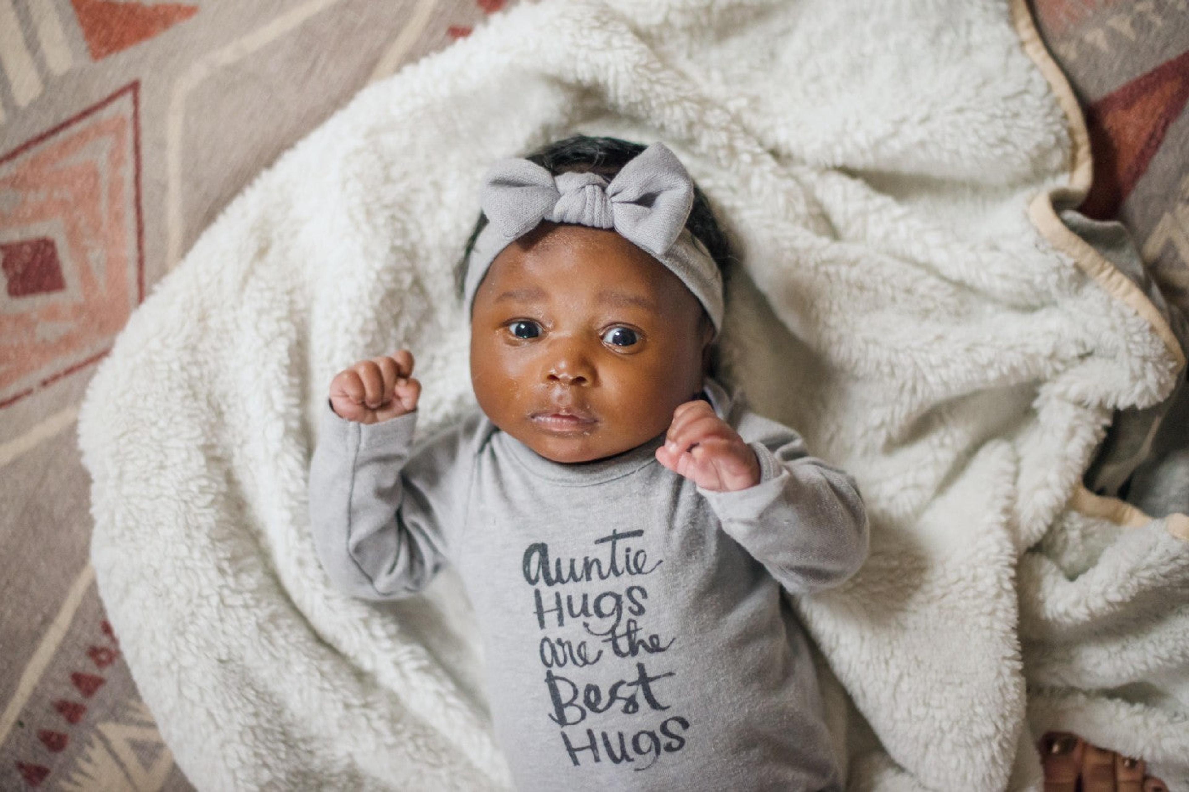 7-week-old baby laying on a blanket