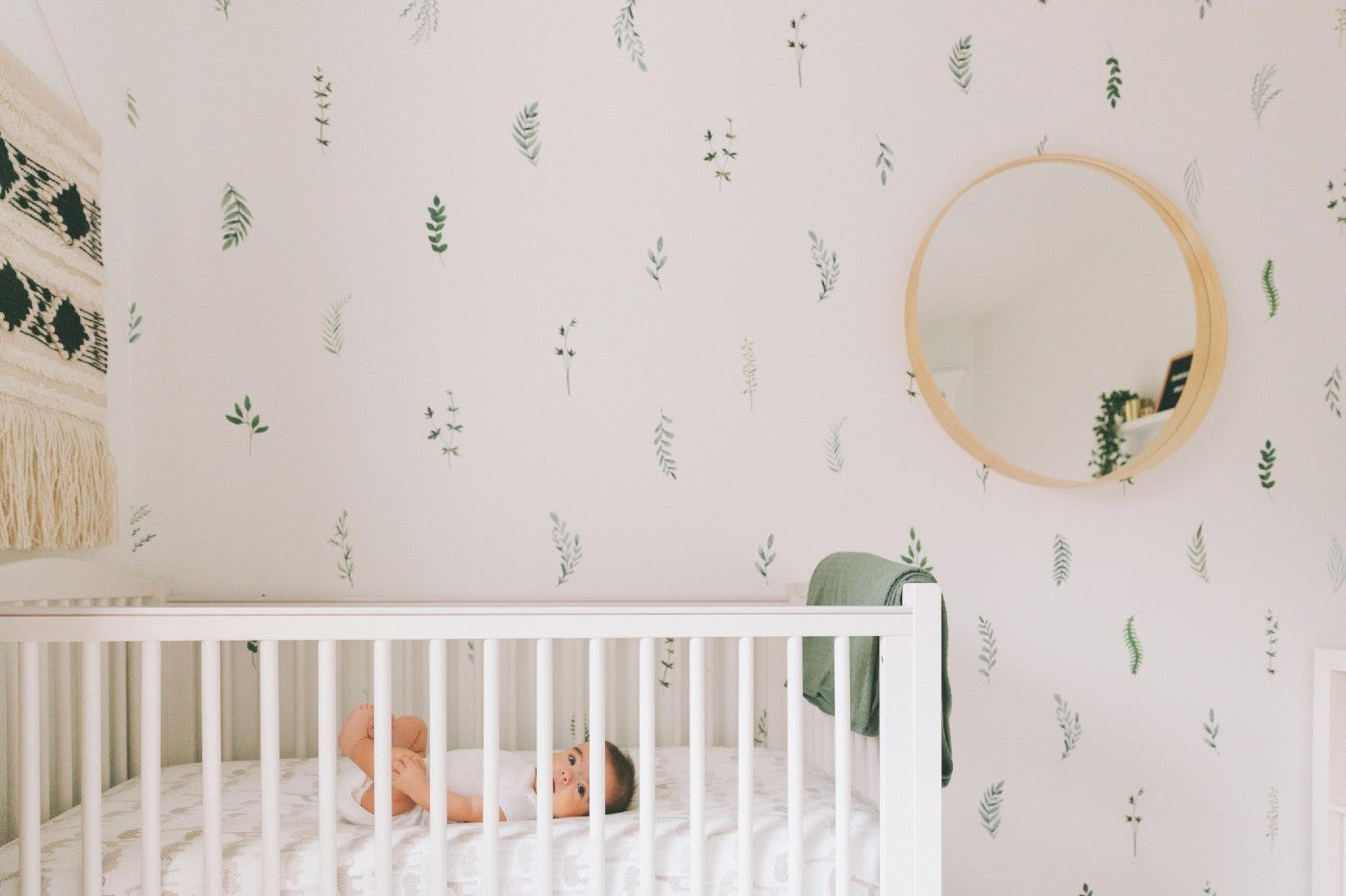 baby-in-nursery-with-nature-wallpaper