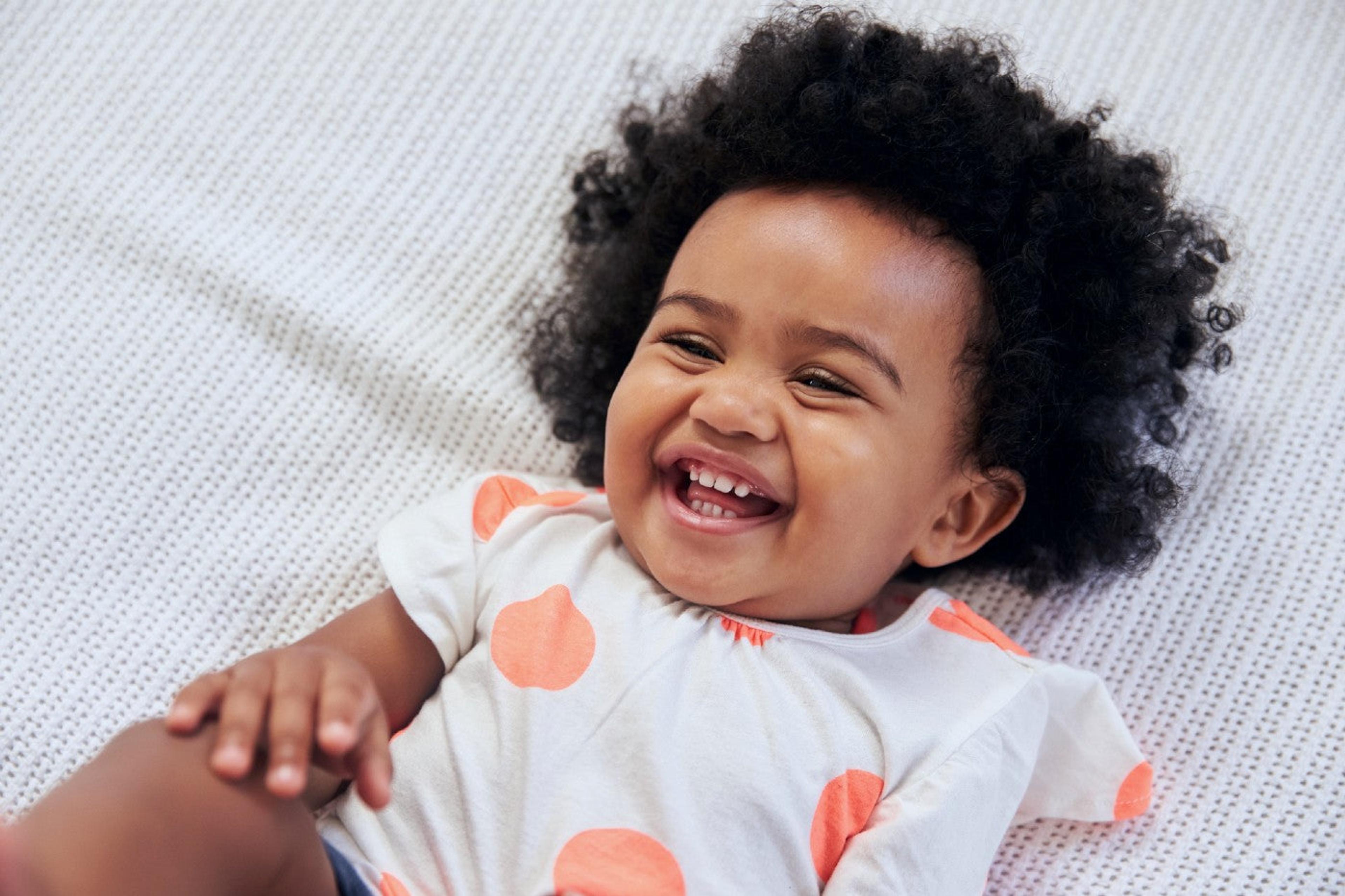 14-month-old baby girl laughing