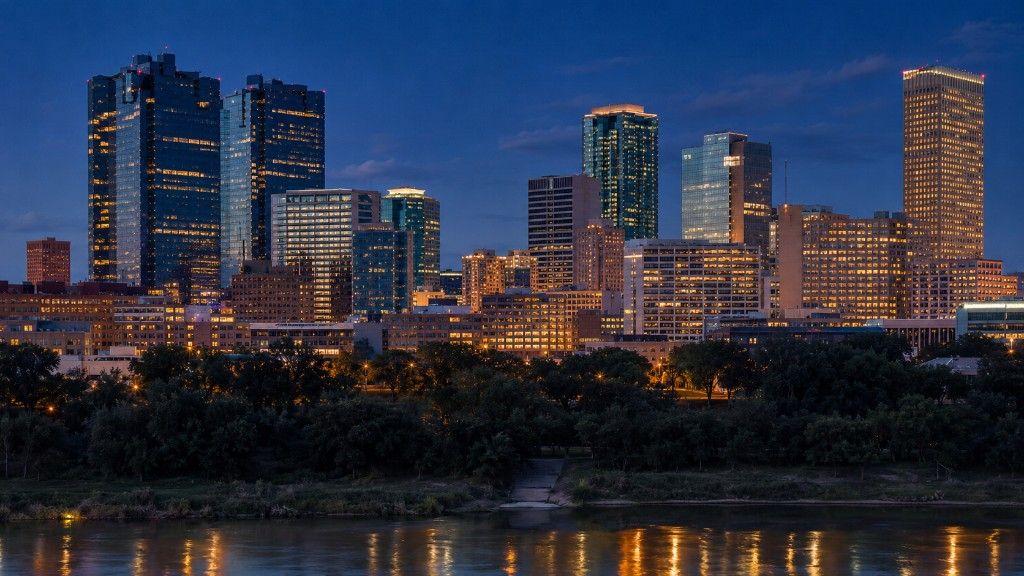 Fort Worth Texas skyline at dusk with the Stockyards in the foreground, representing the 2026 Fort Worth housing market