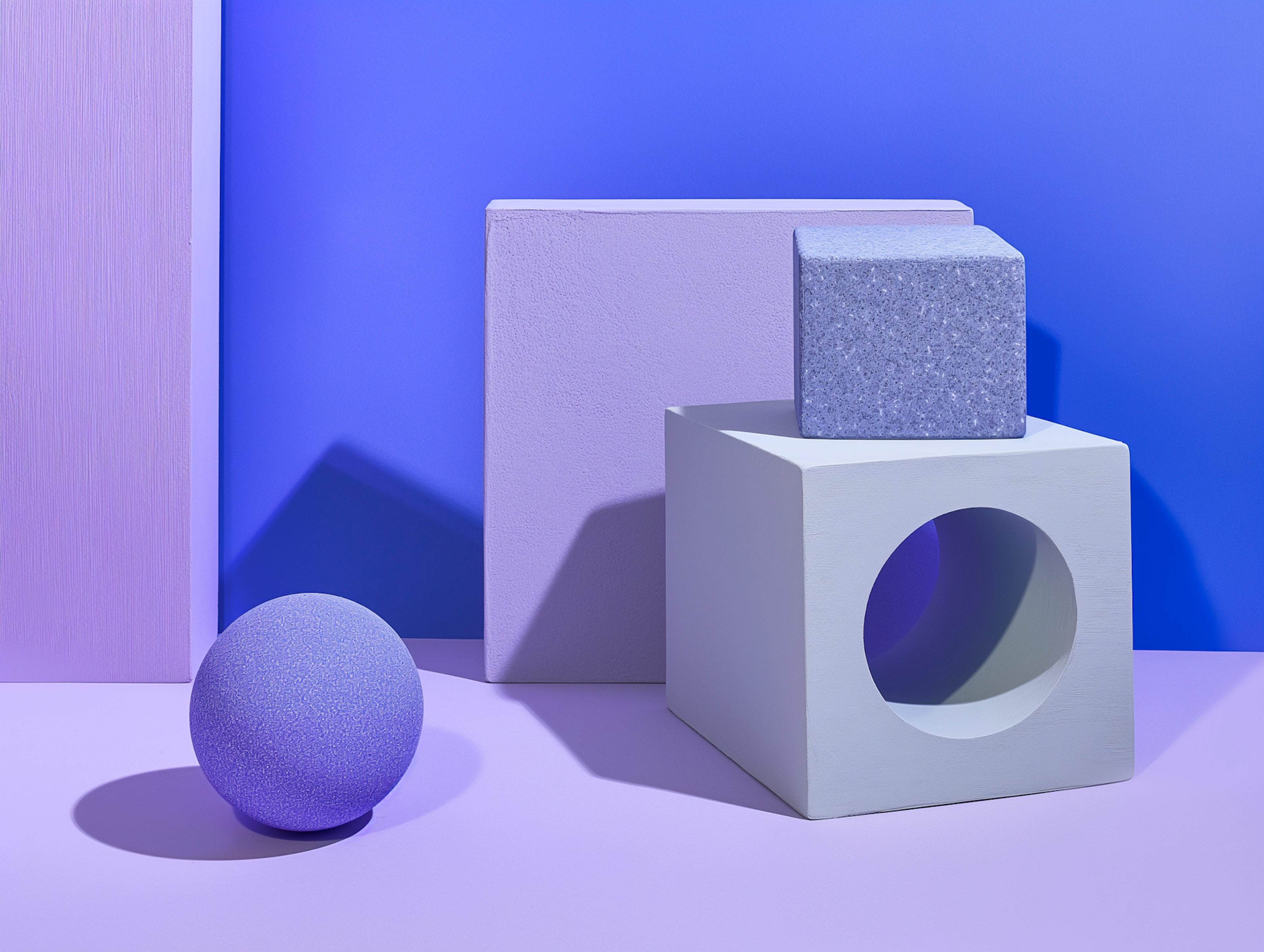 Lilac cubes and a sphere in soft purple light