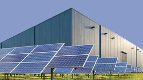 Stylised image of solar panels in front of a warehouse