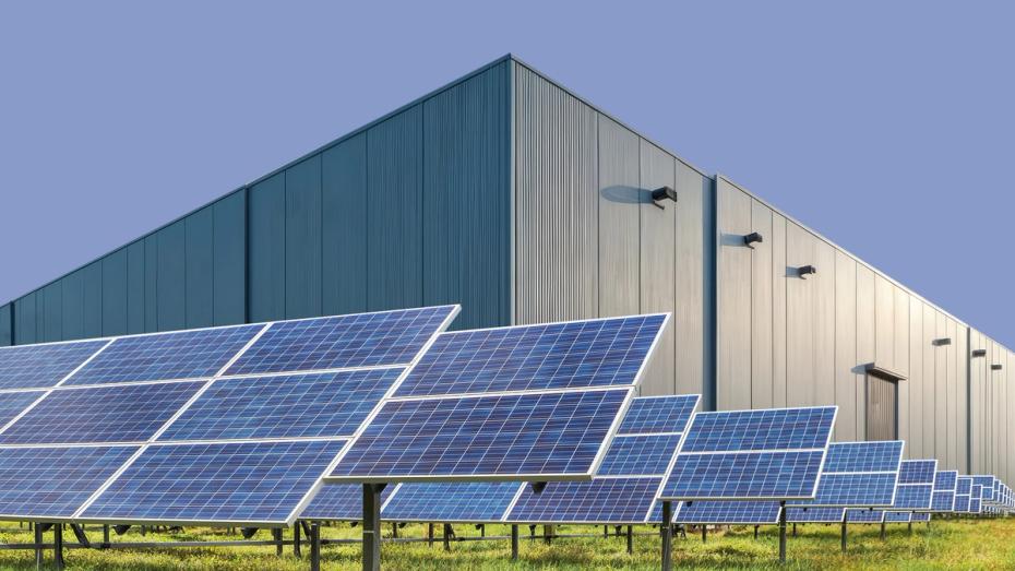 Stylised image of solar panels in front of a warehouse