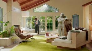 Picture showing a robot tidying a living room