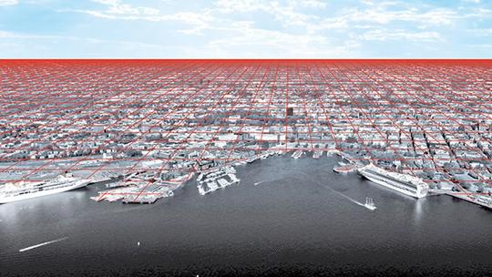 Aerial view of a cityscape overlaid with a red grid pattern extending into the horizon, depicting urban planning or network connectivity, with a waterfront and ships in the foreground.
