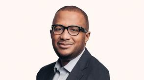 Head and shoulder image of Erwin Thompson, CEO, EQT Infrastructure Company wearing a suit jacket, dress shirt and glasses.