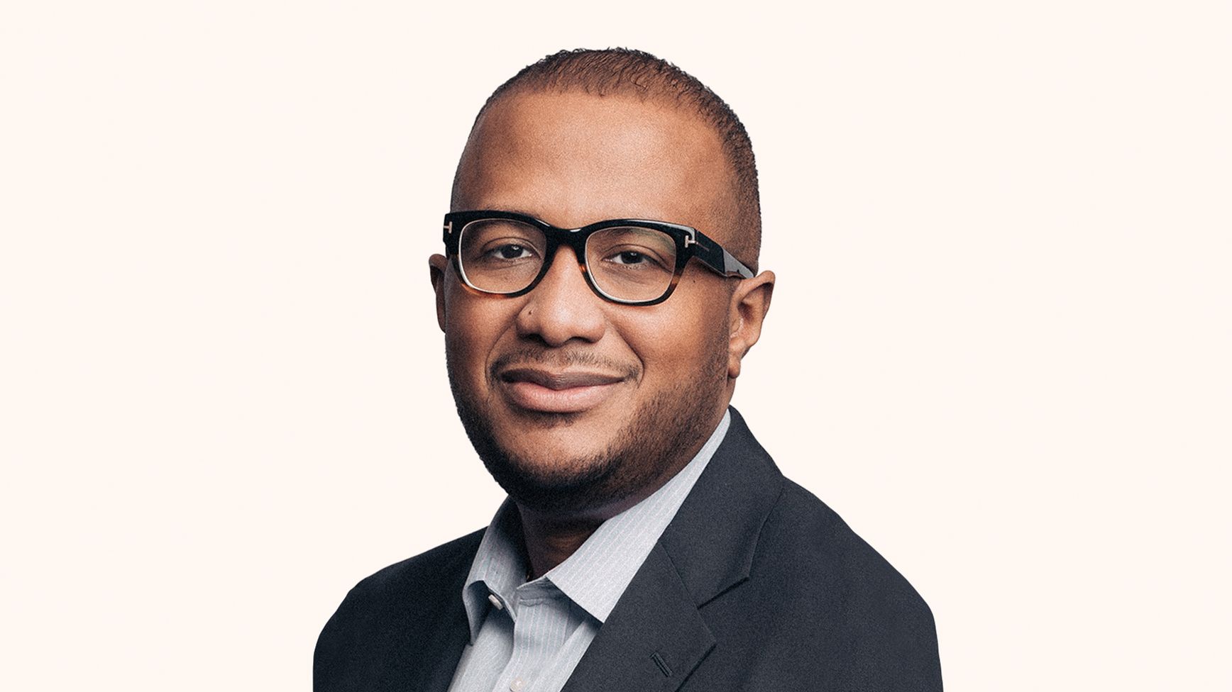 Head and shoulder image of Erwin Thompson, CEO, EQT Infrastructure Company wearing a suit jacket, dress shirt and glasses.