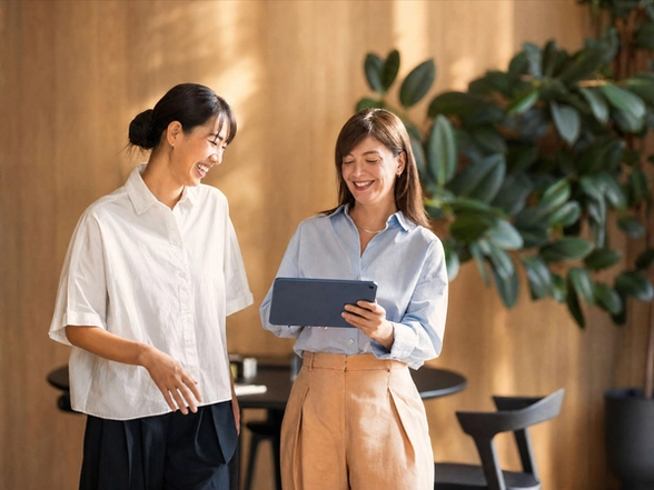 Two women looking at a tablet