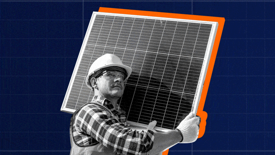Dollar bills rain down around a man holding a solar panel.