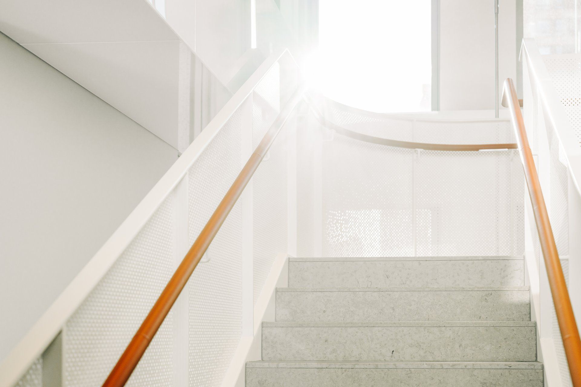 Stairwell with orange railings 