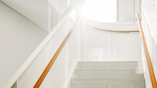 Stairwell with orange railings